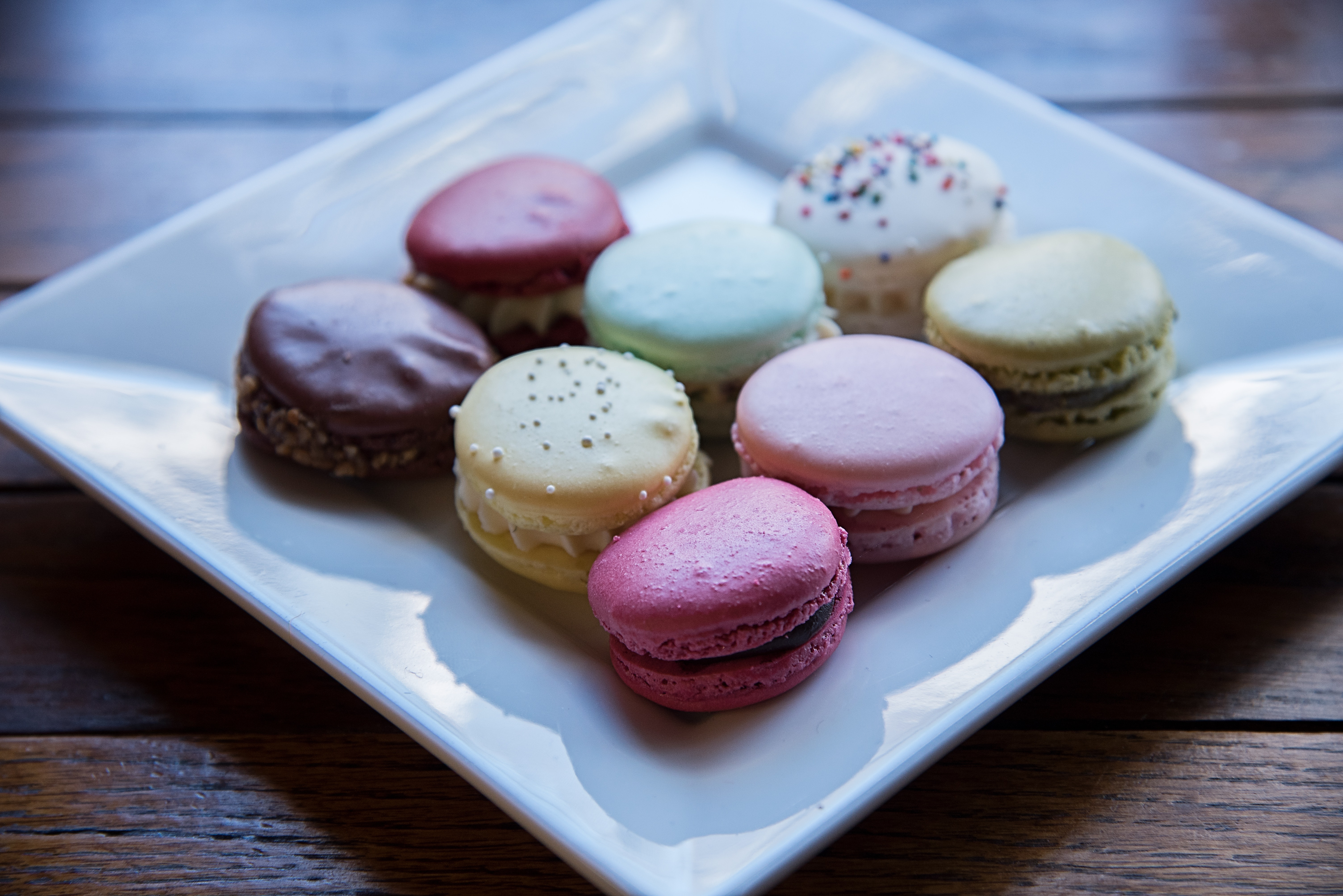 Macaroons served on white ceramic plate photo