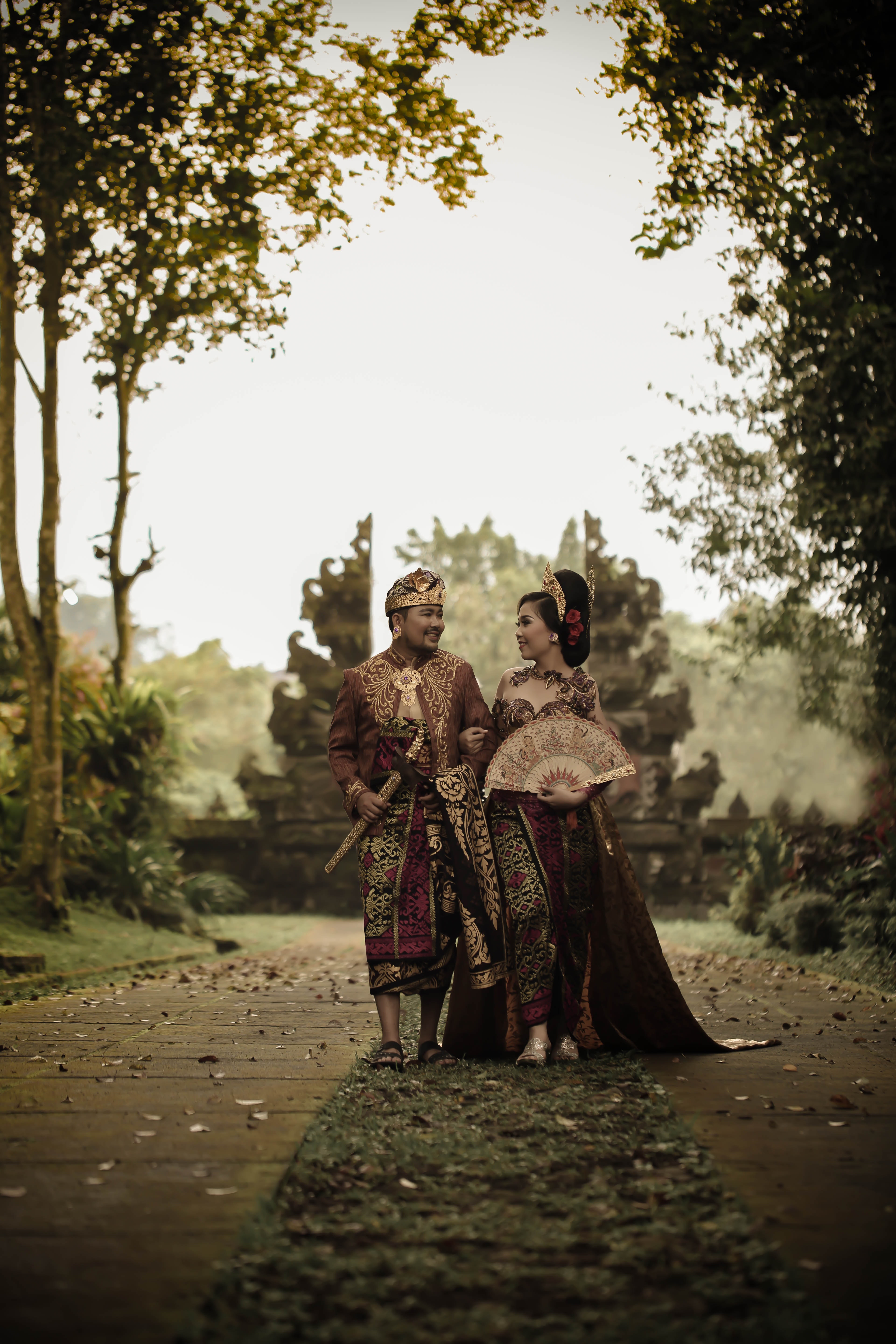 Man and woman in traditional clothing near angkor wat photo