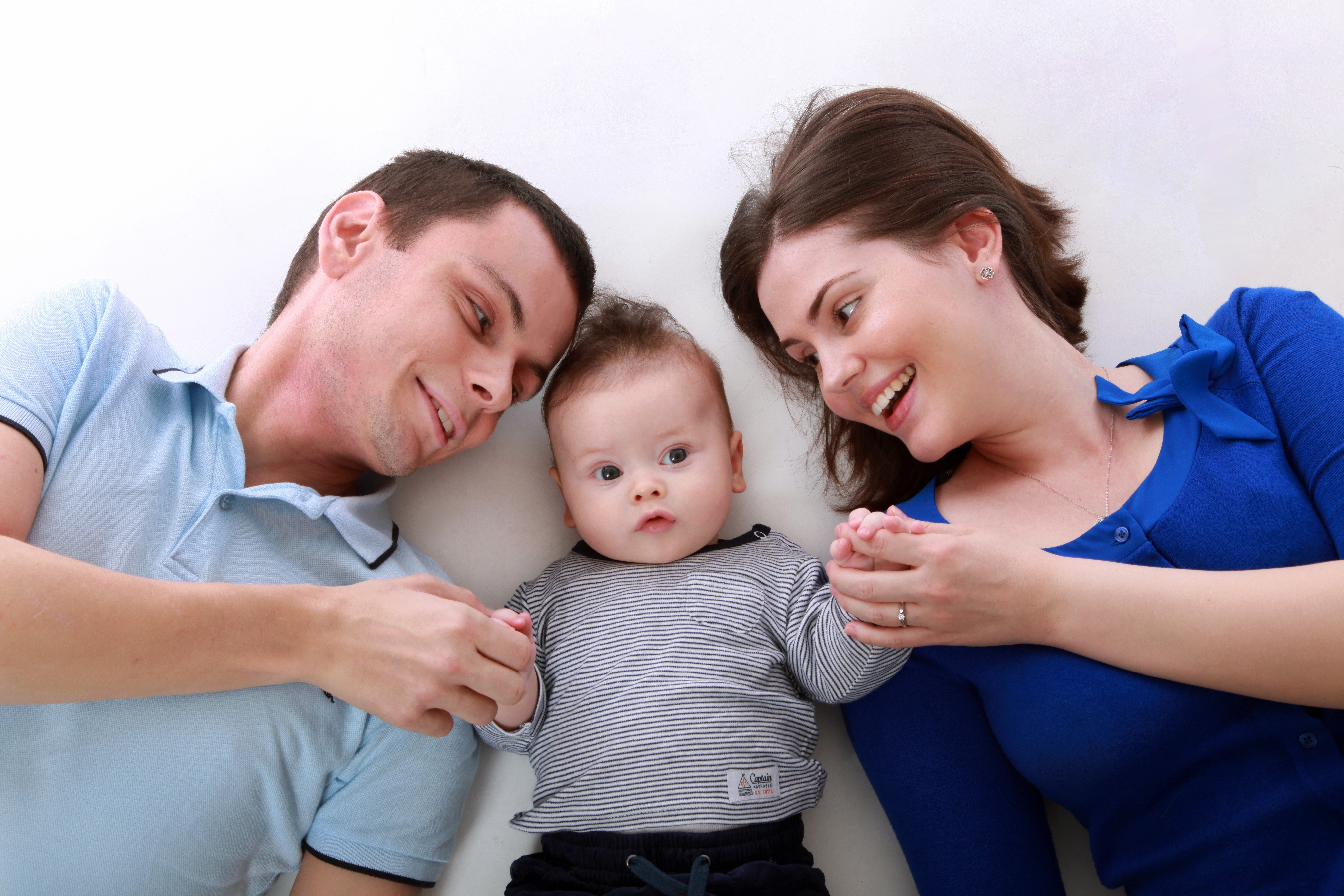 Man beside baby and woman photo