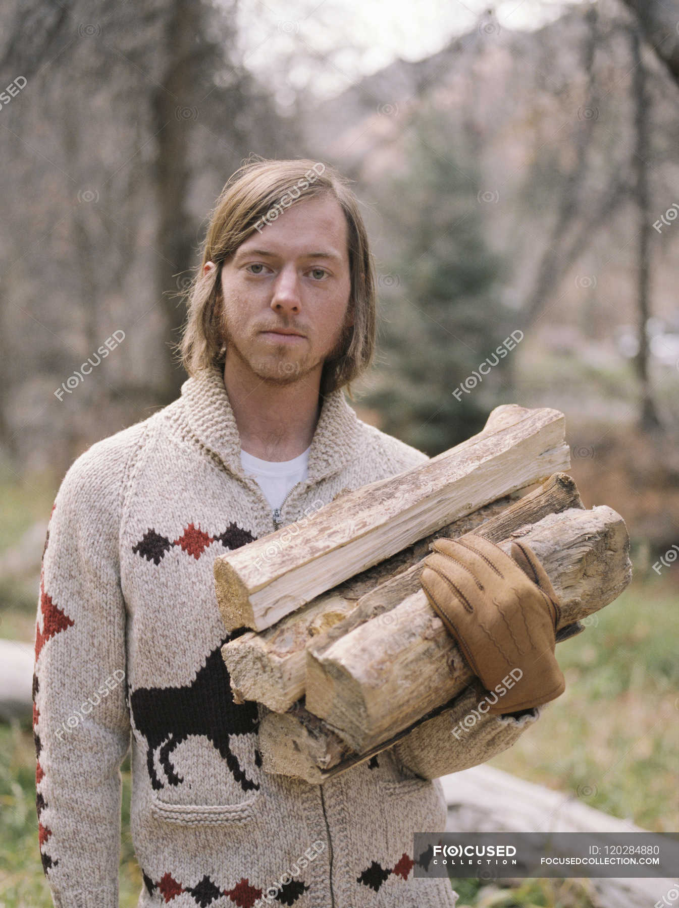 Man carrying firewood — Stock Photo | #120284880