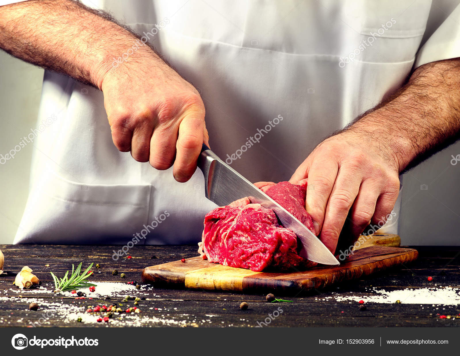 Man cutting raw beef meat — Stock Photo © bit245 #152903956