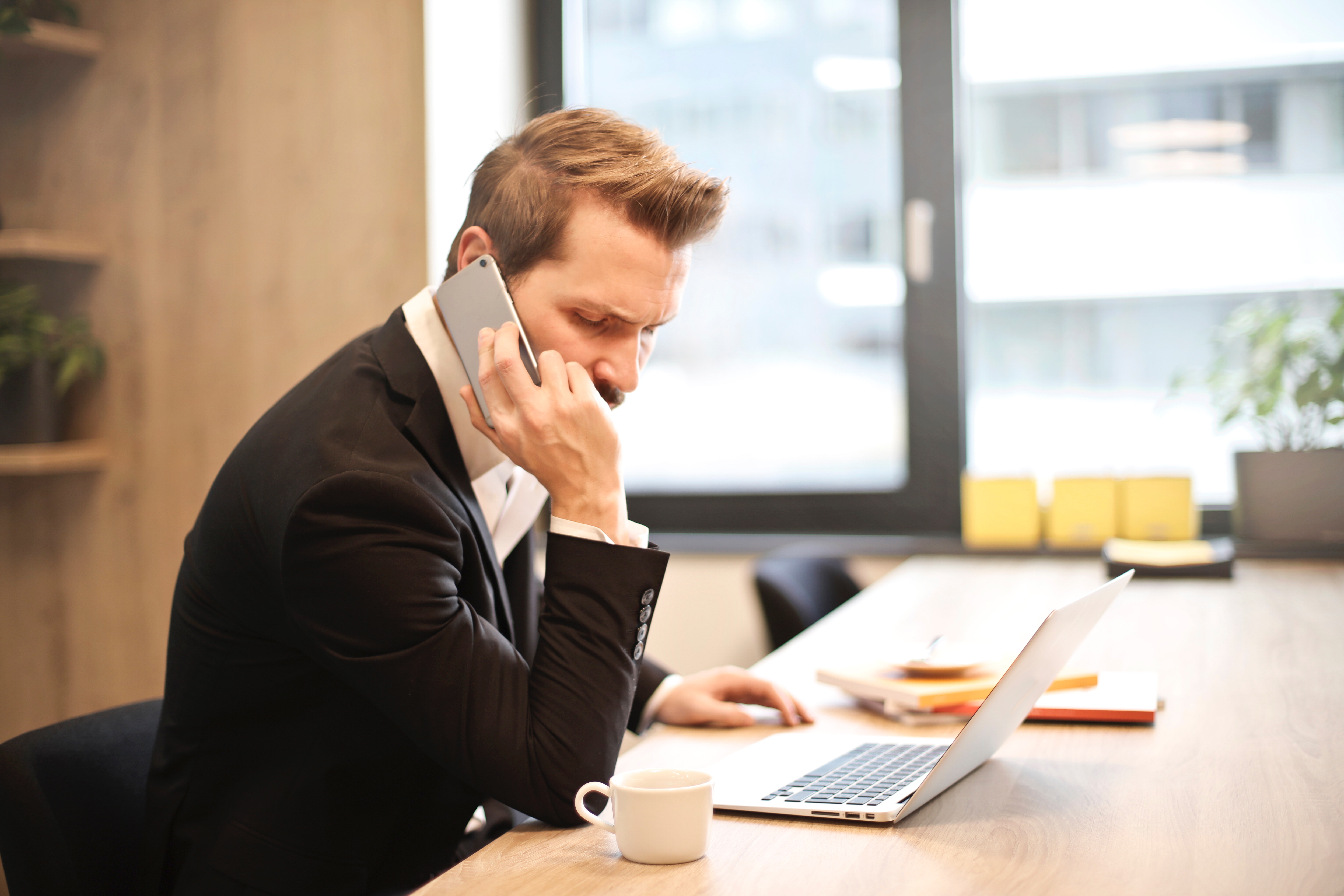Man Having a Phone Call In-front of a Laptop, Calling, Mobile phone, Window, Wear, HQ Photo