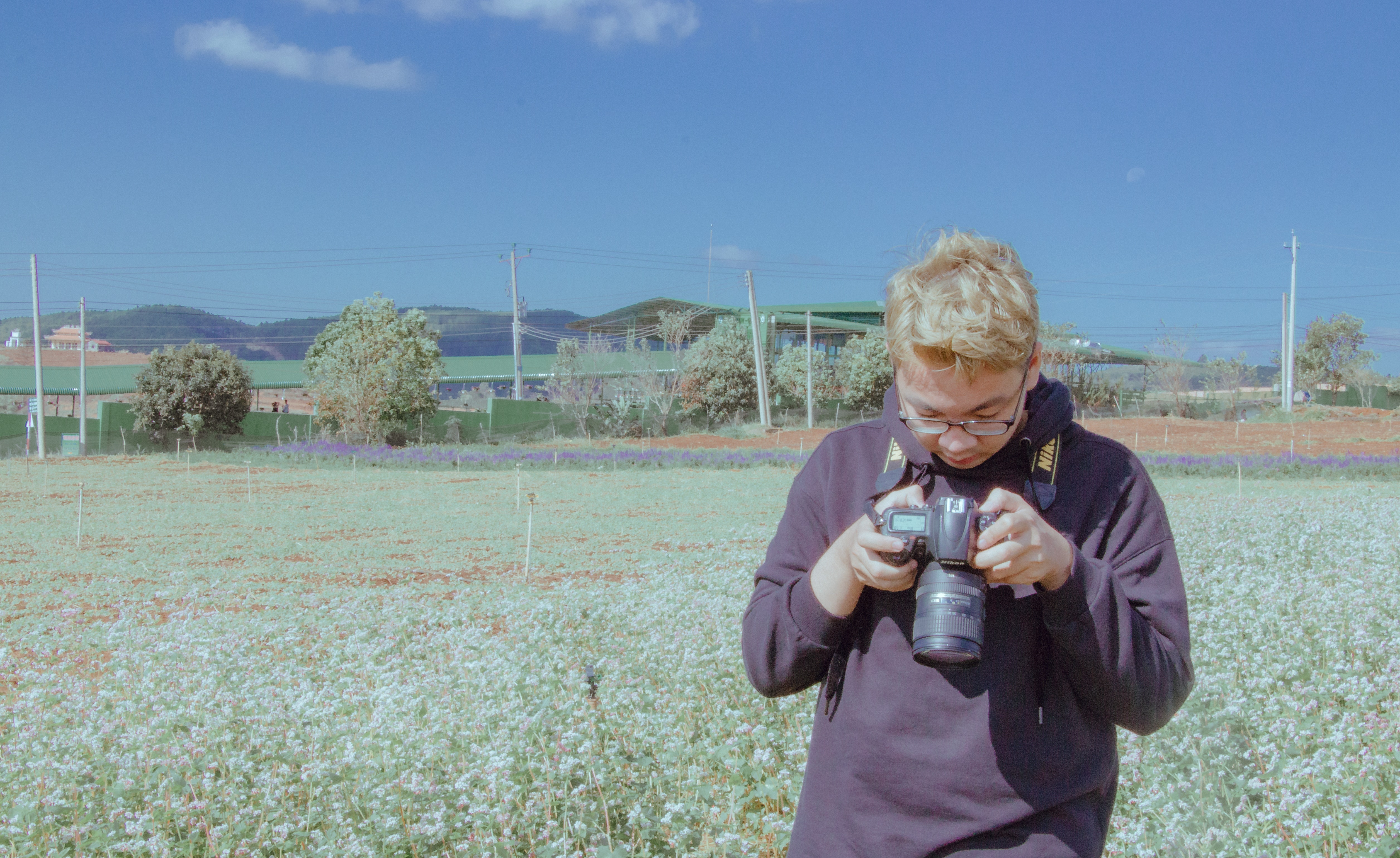 Man Holding Black Dslr Camera Standing on Open Field Under Blue Sky, Camera, Cropland, Crops, Daytime, HQ Photo