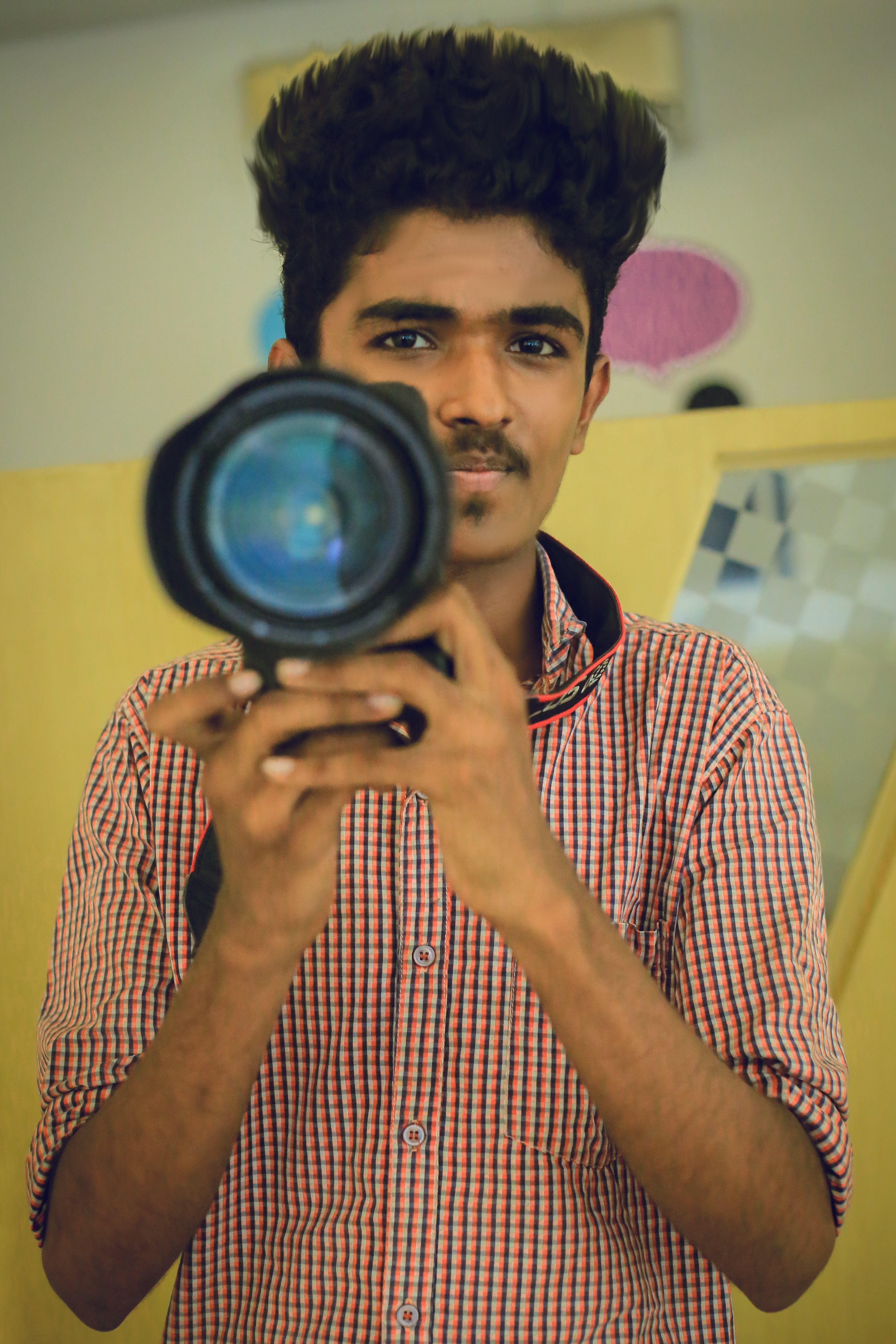 Man holding dslr camera photo