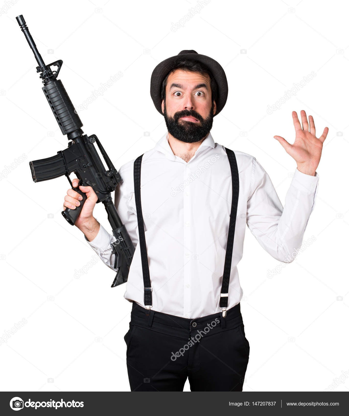 Hipster man with beard holding a rifle — Stock Photo © luismolinero ...