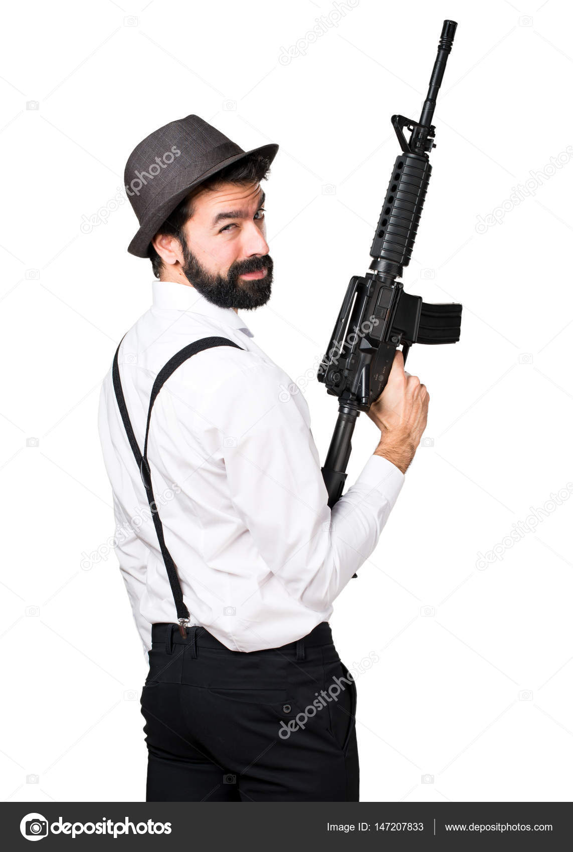 Hipster man with beard holding a rifle — Stock Photo © luismolinero ...