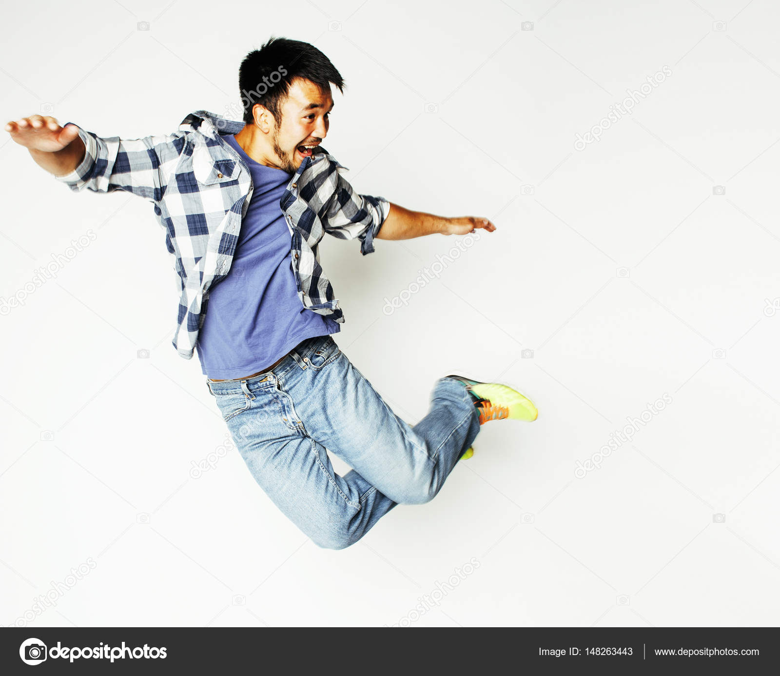 young pretty asian man jumping cheerful against white background ...