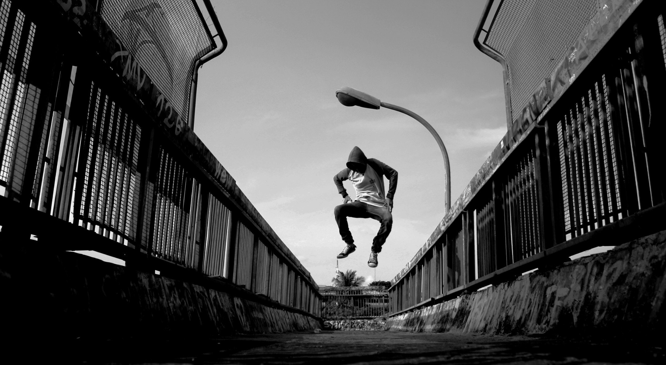 Man Jumping on Air Wearing Gray Hoodie, Black-and-white, Bridge, Dancing, Hiphop, HQ Photo