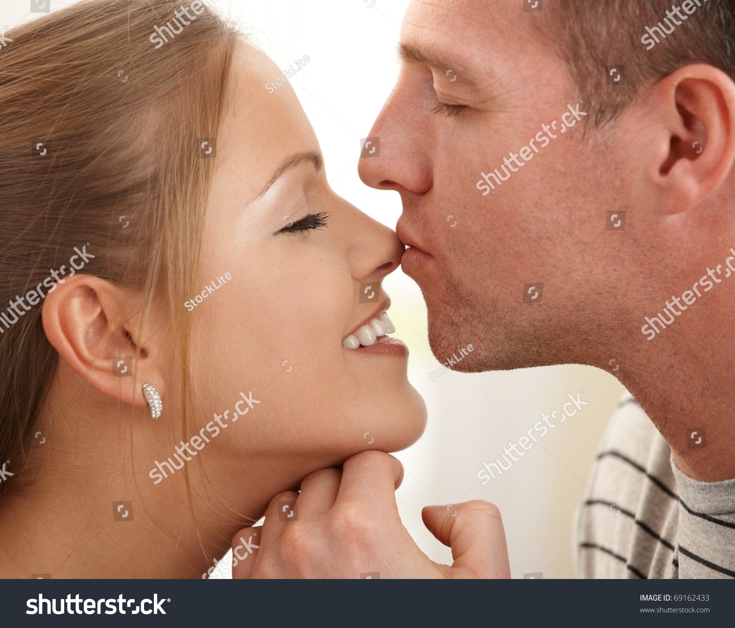 Man Kissing Happy Womans Nose Stroking Stock Photo (Royalty Free ...