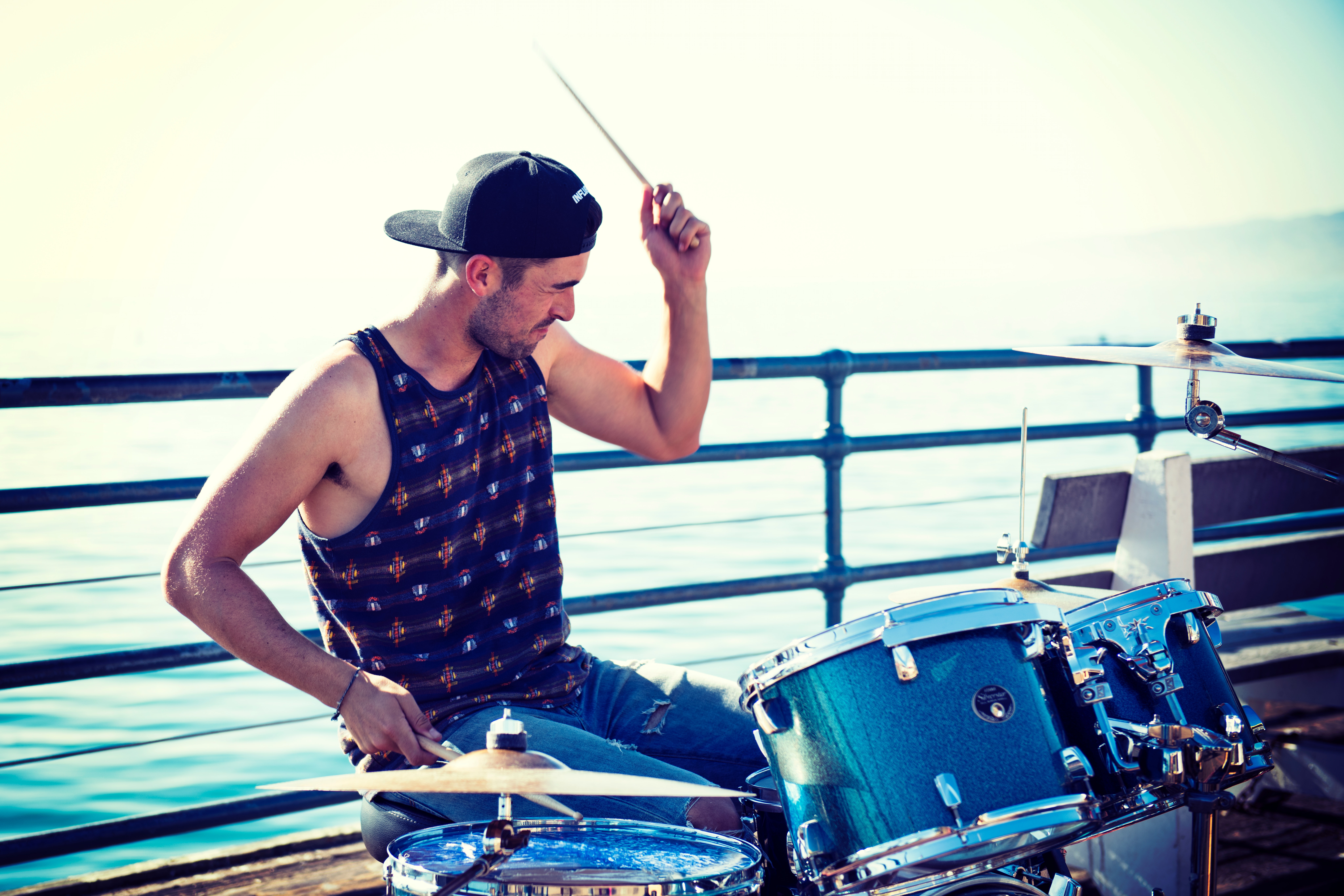 Man Playing Drum Near Bay at Day Time, Person, Musician, Ocean, Outdoors, HQ Photo