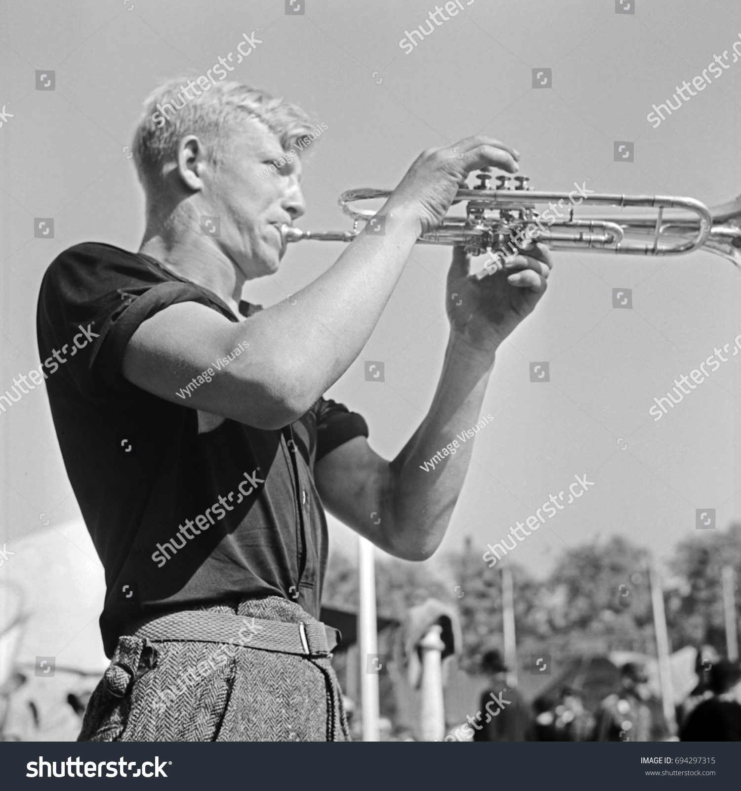 Young Man Playing Trumpet Stock Photo 694297315 - Shutterstock