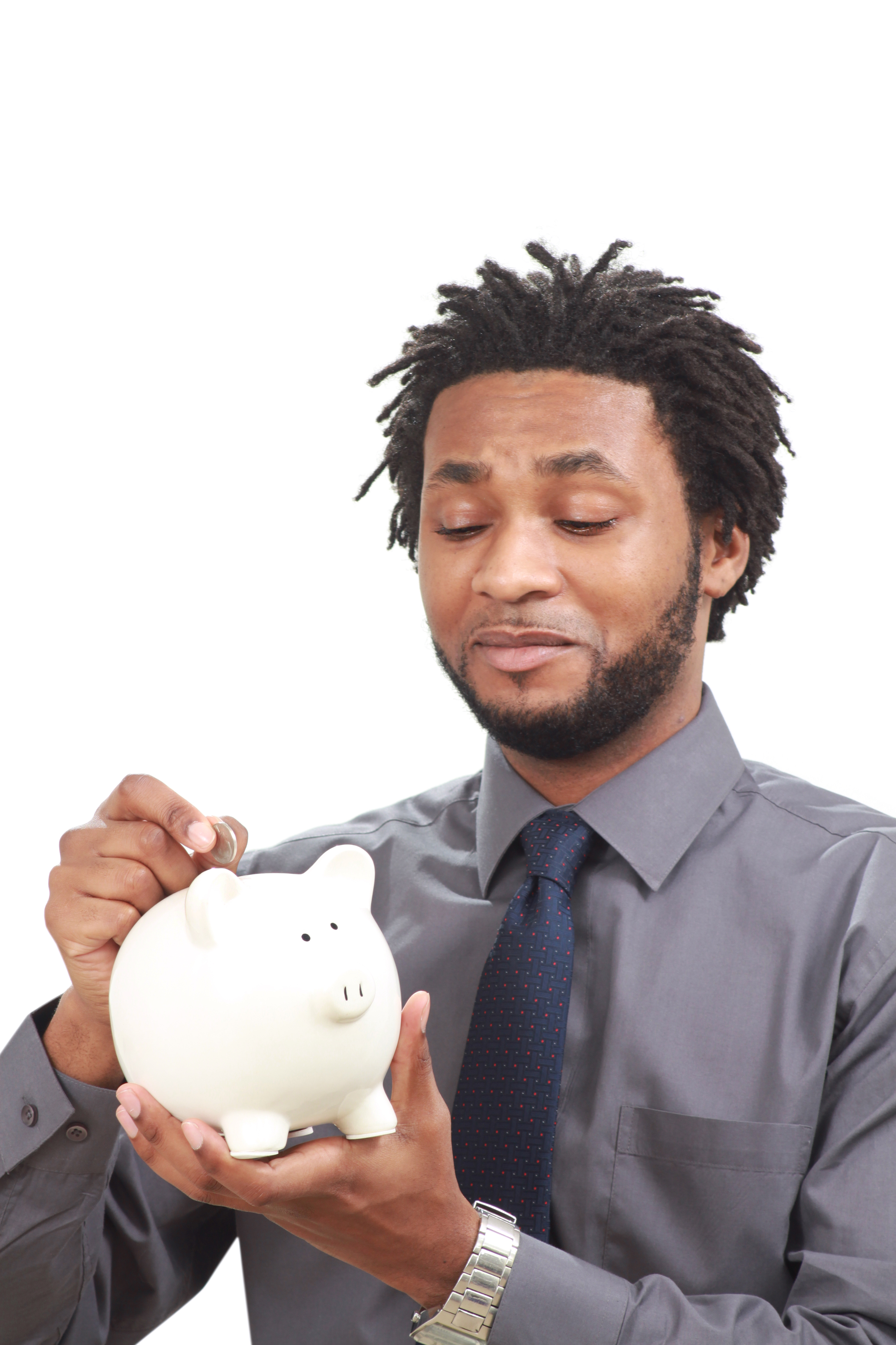 Man putting money into a piggy bank photo