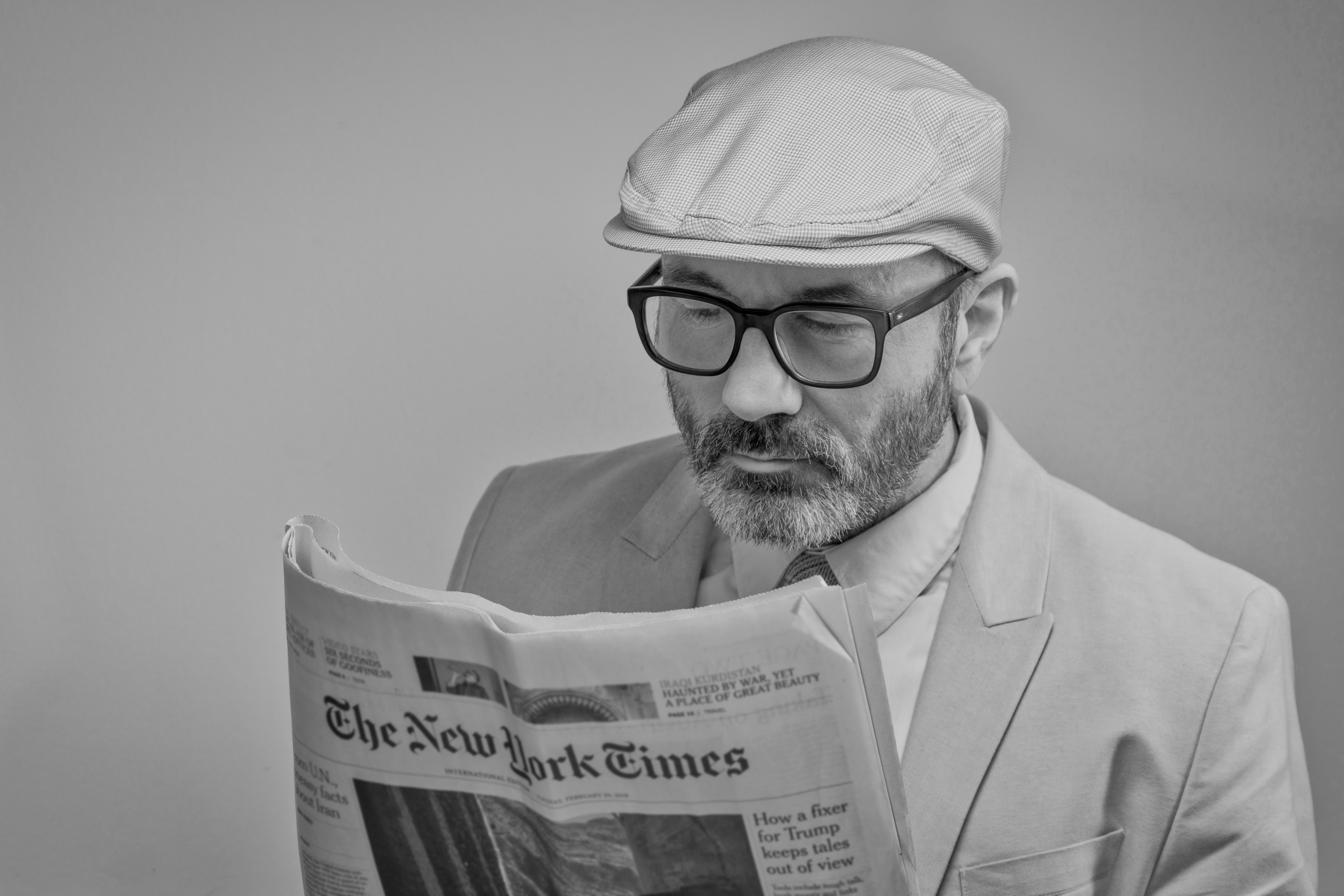 Man reading a newspaper photo