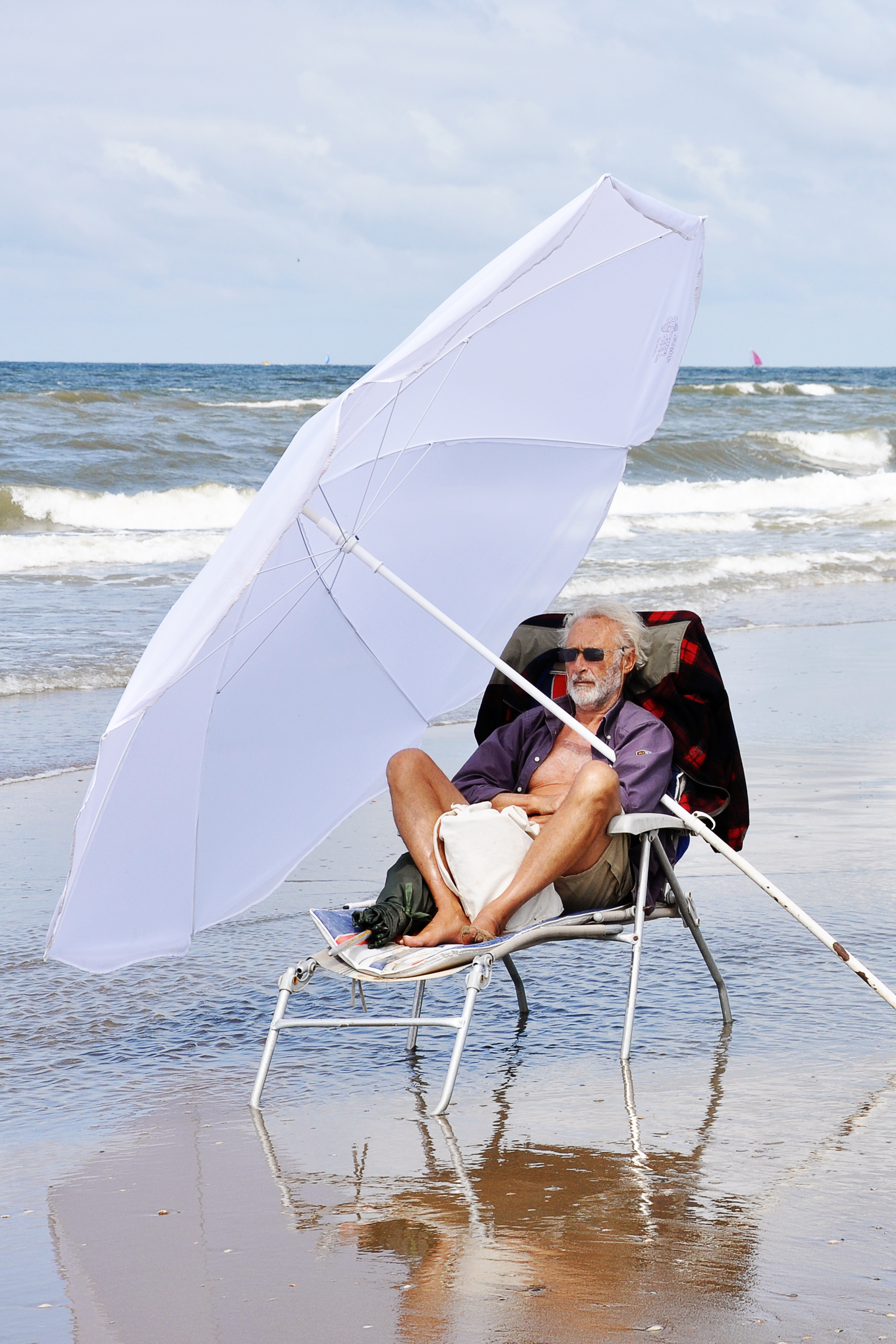 Man relaxing on beach photo