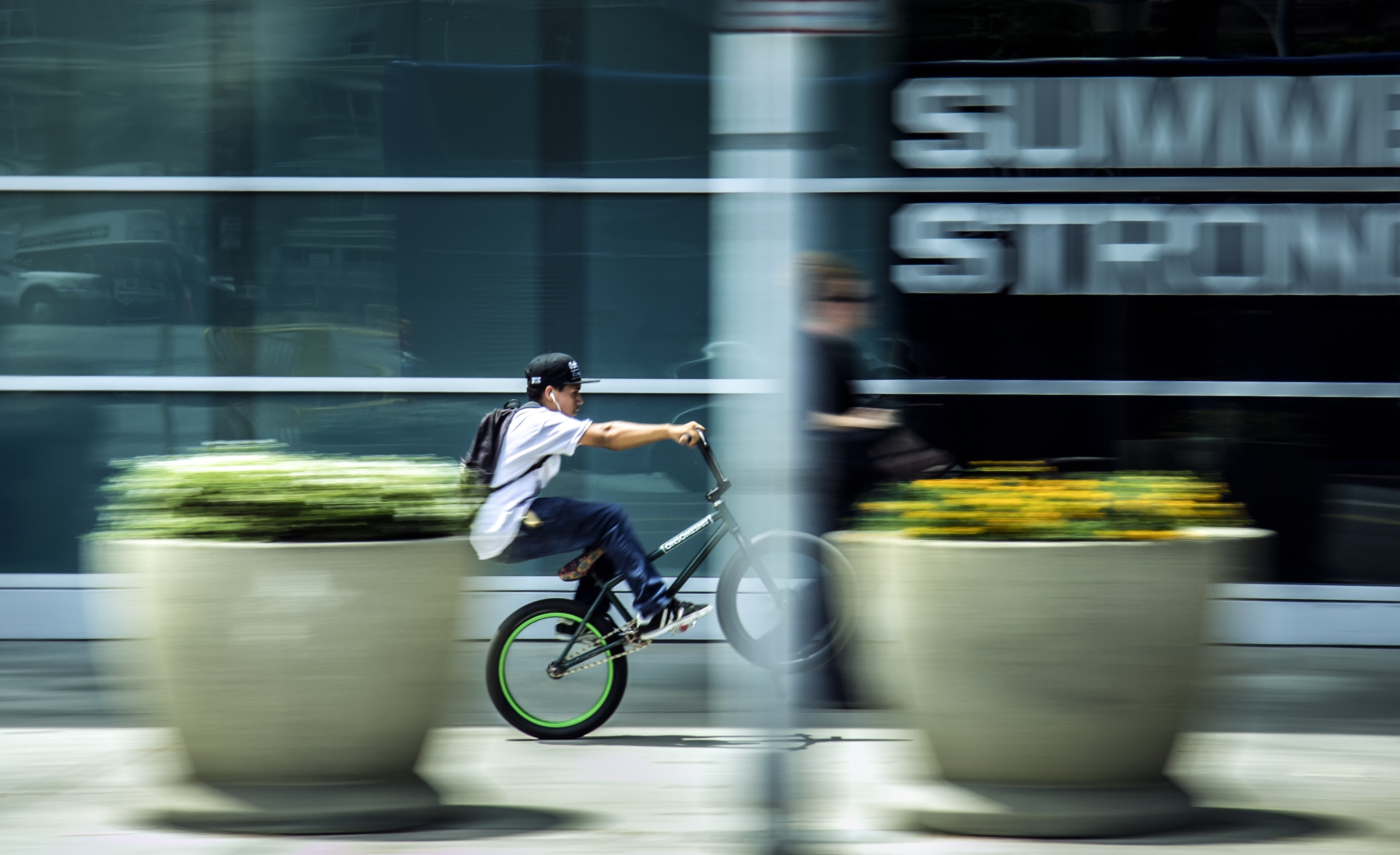 Man riding bicycle in city photo
