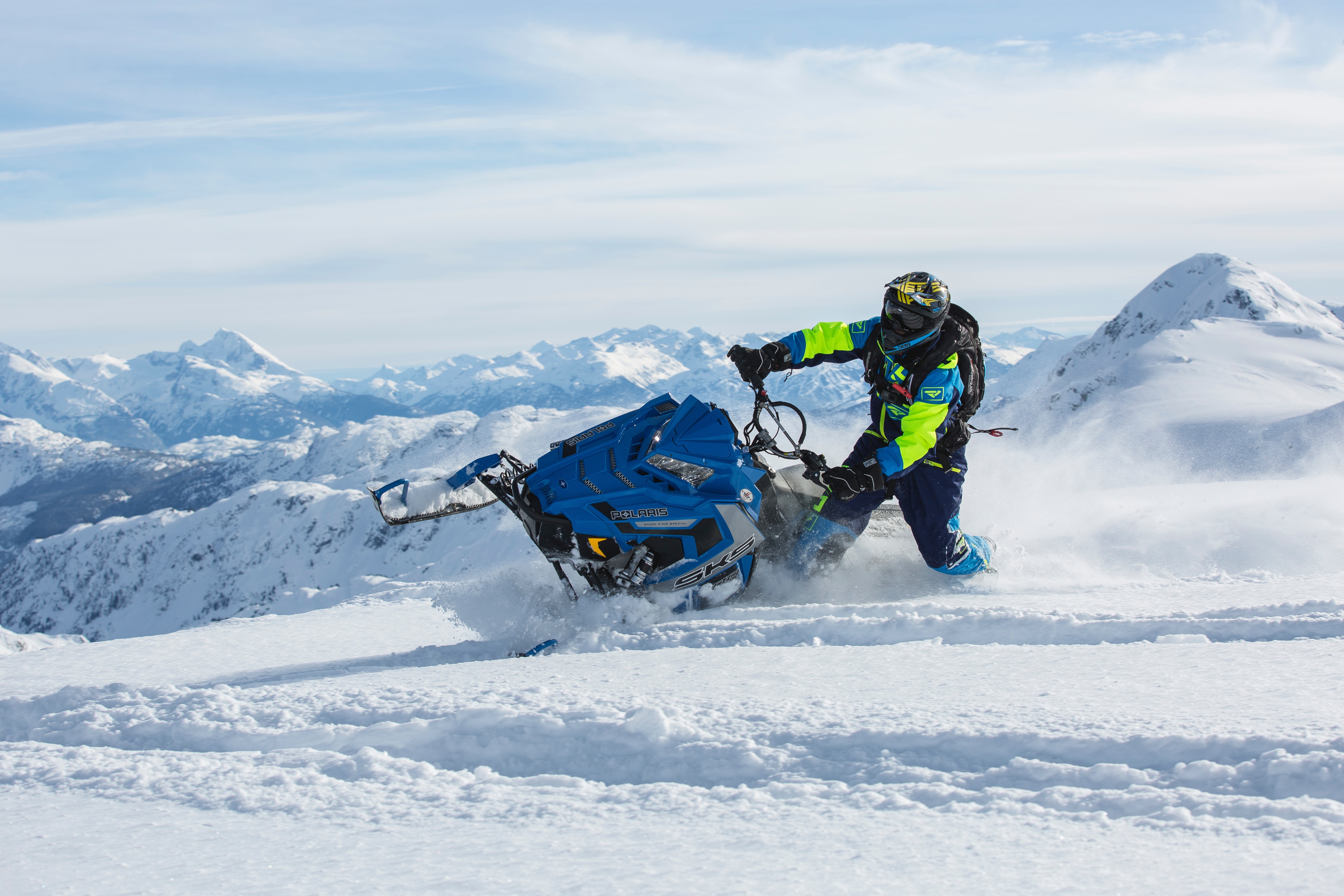 Man riding blue snow ski scooter photo