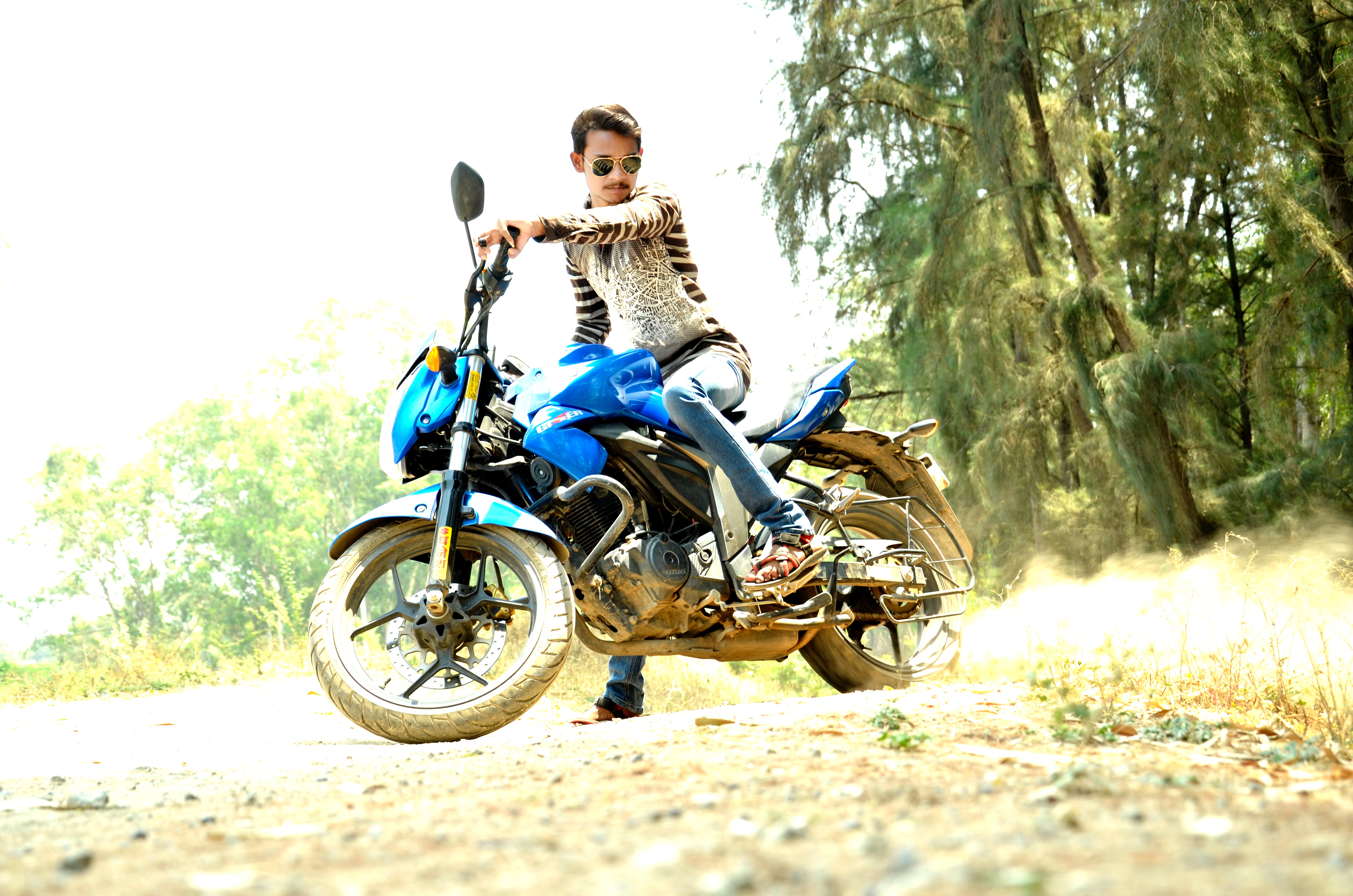 Man riding blue sports bike photo