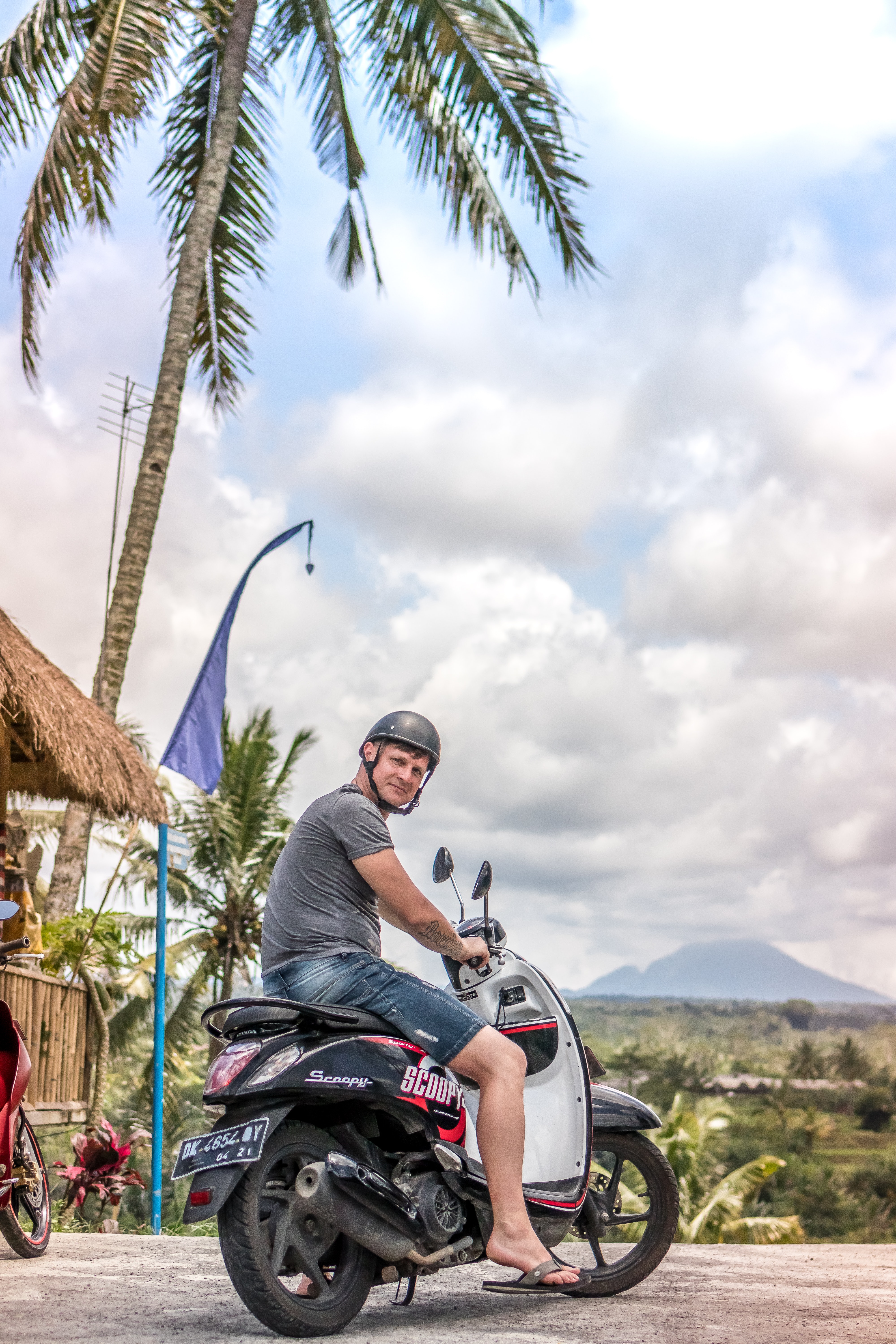 Man riding motor scooter photo