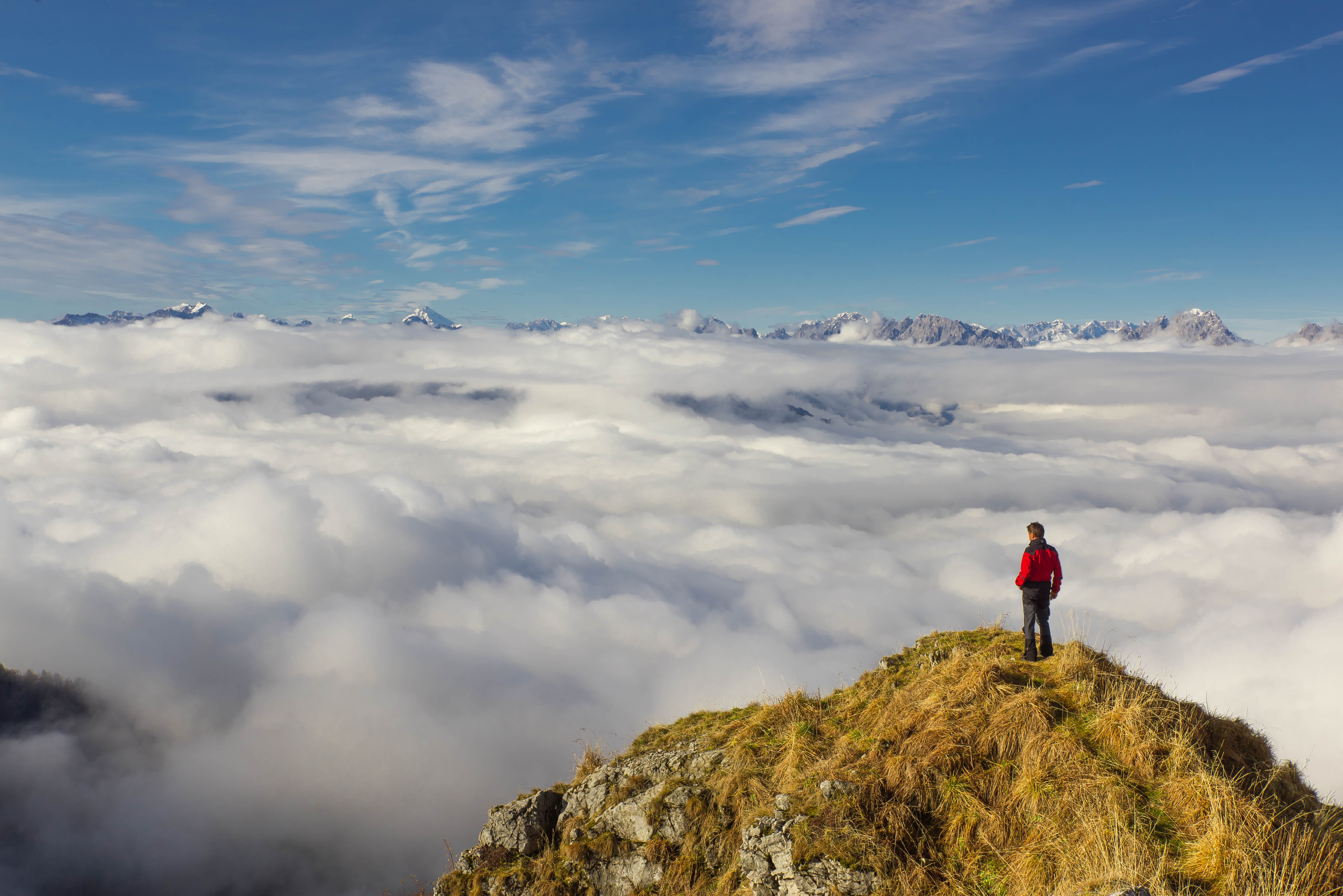 Man standing on mountain against sky photo
