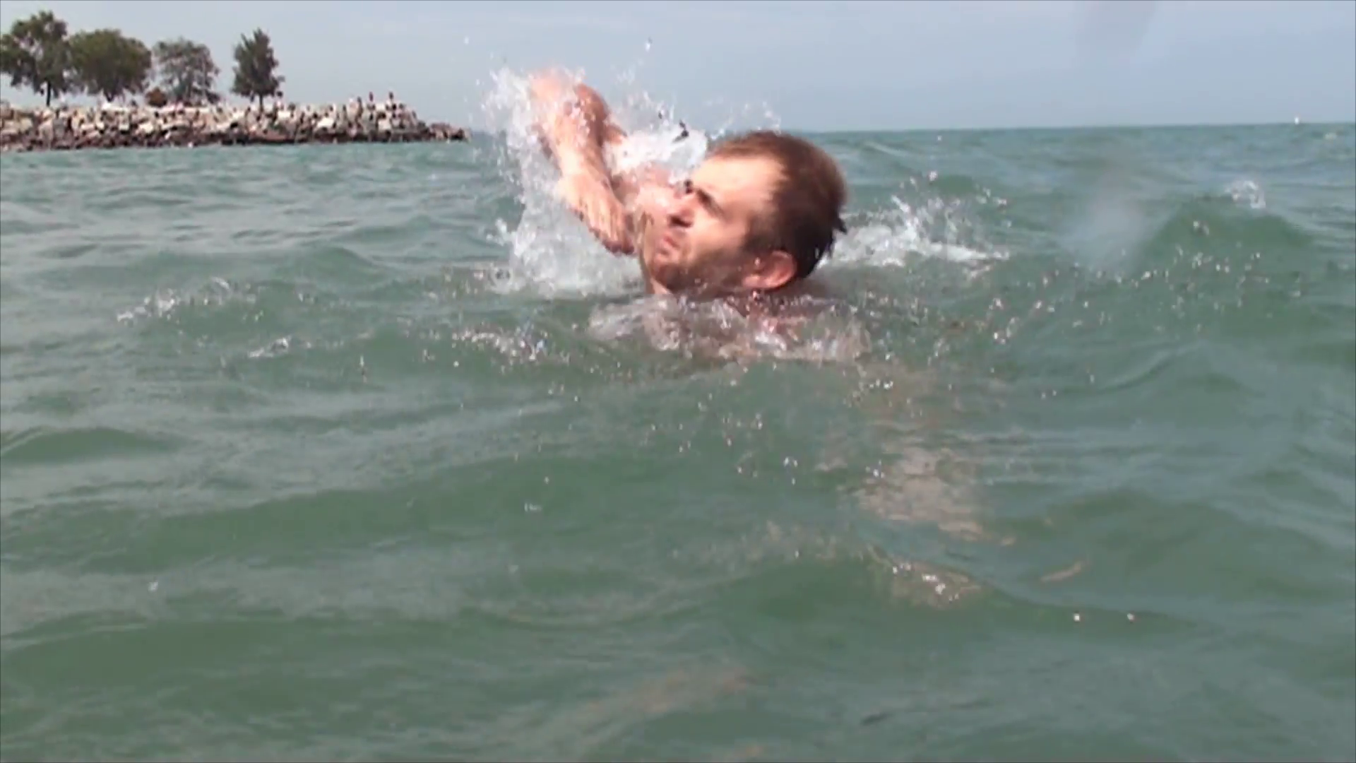 Young man swimming in slow motion at Lake Michigan Stock Video ...
