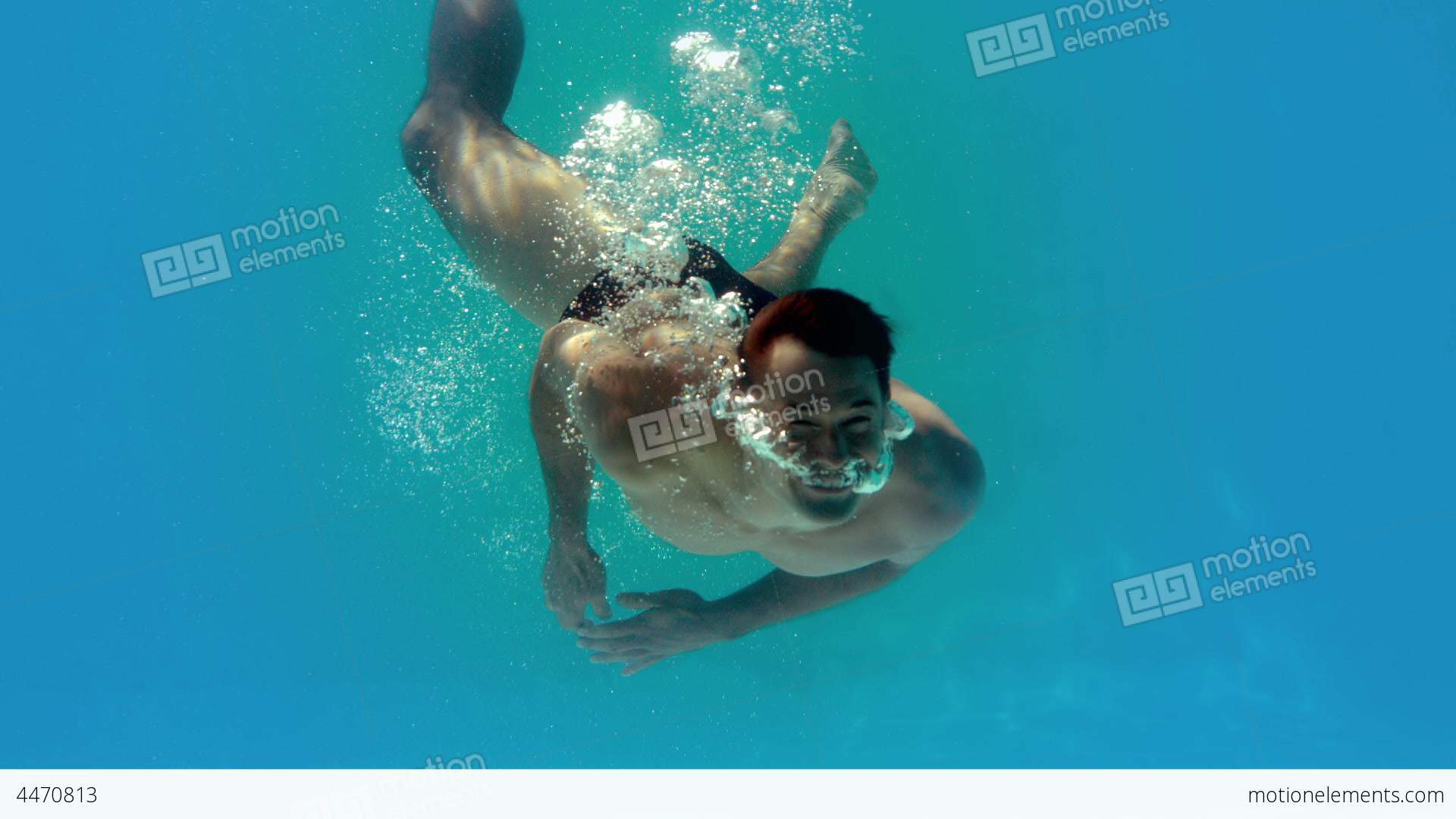 Fit Man Spinning Around Underwater In Swimming Poo Stock video ...