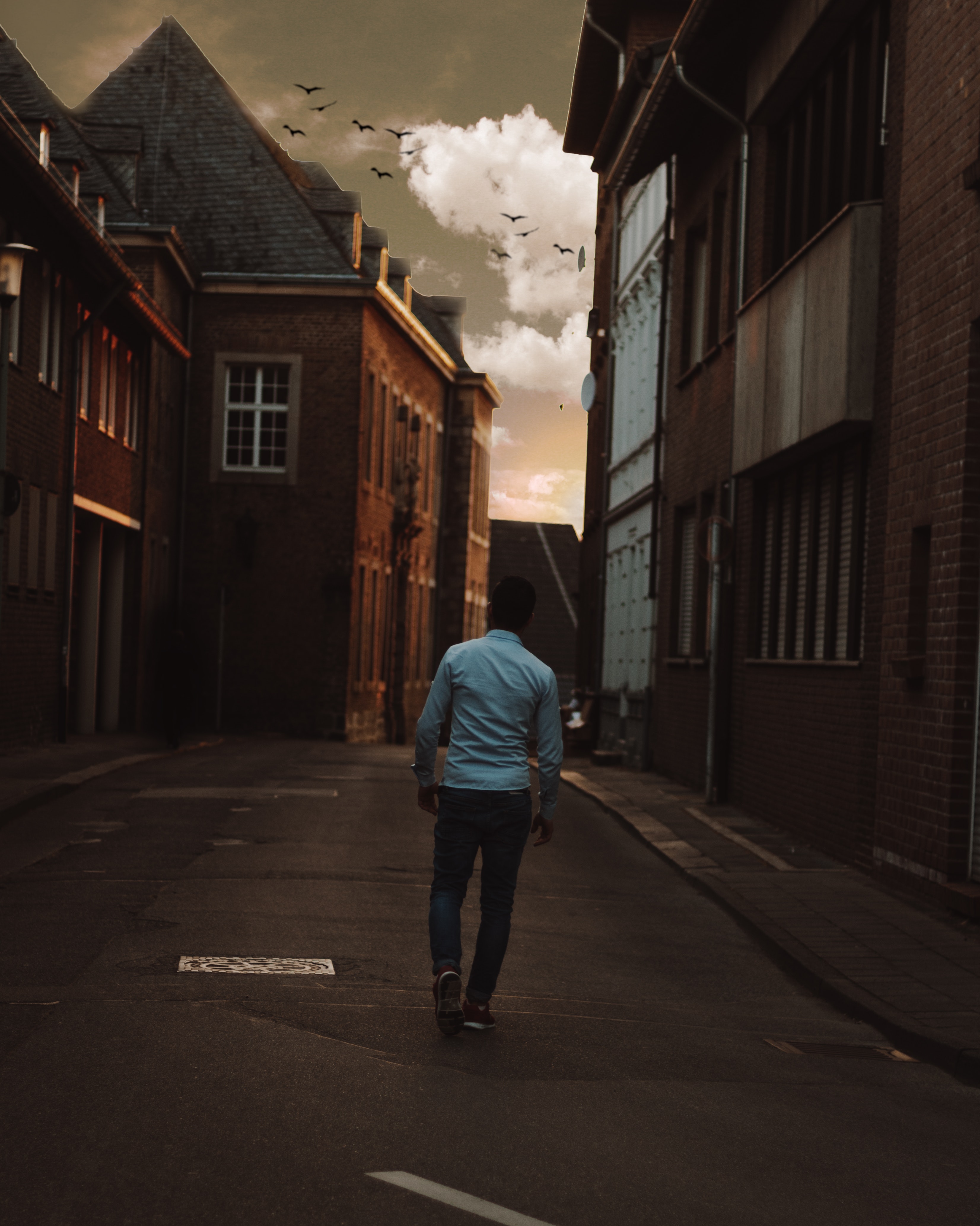 Man walking alone in the street of town photo