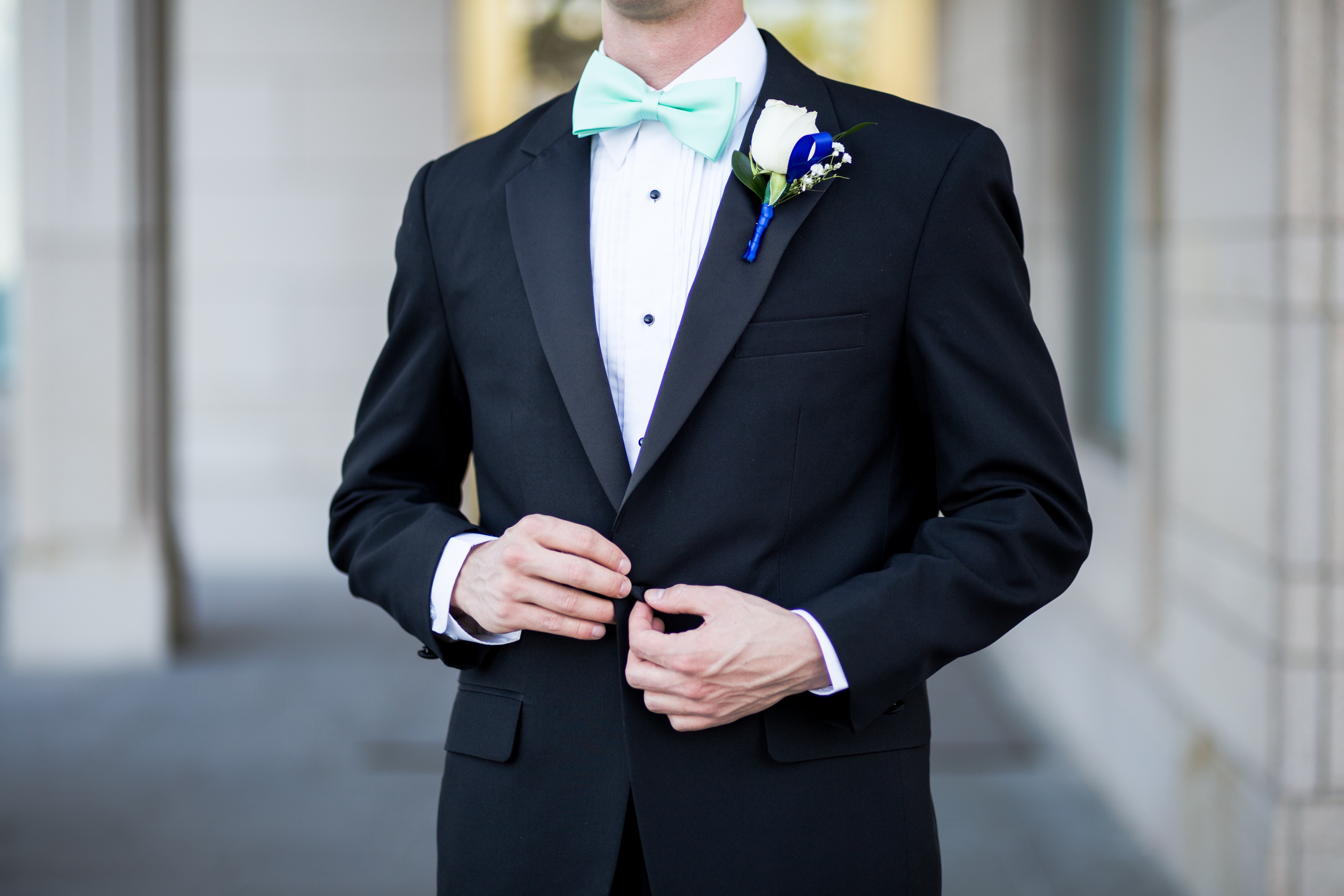 Man wearing black and teal tuxedo photo