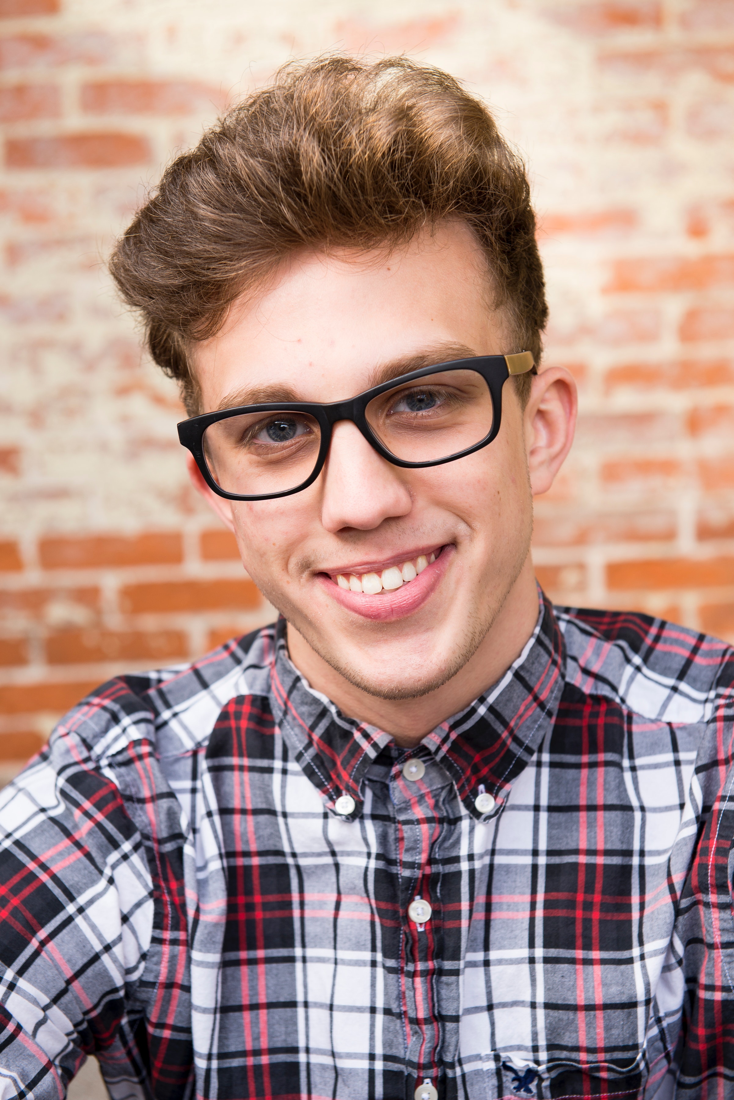 Man wearing eyeglasses and smiling photo
