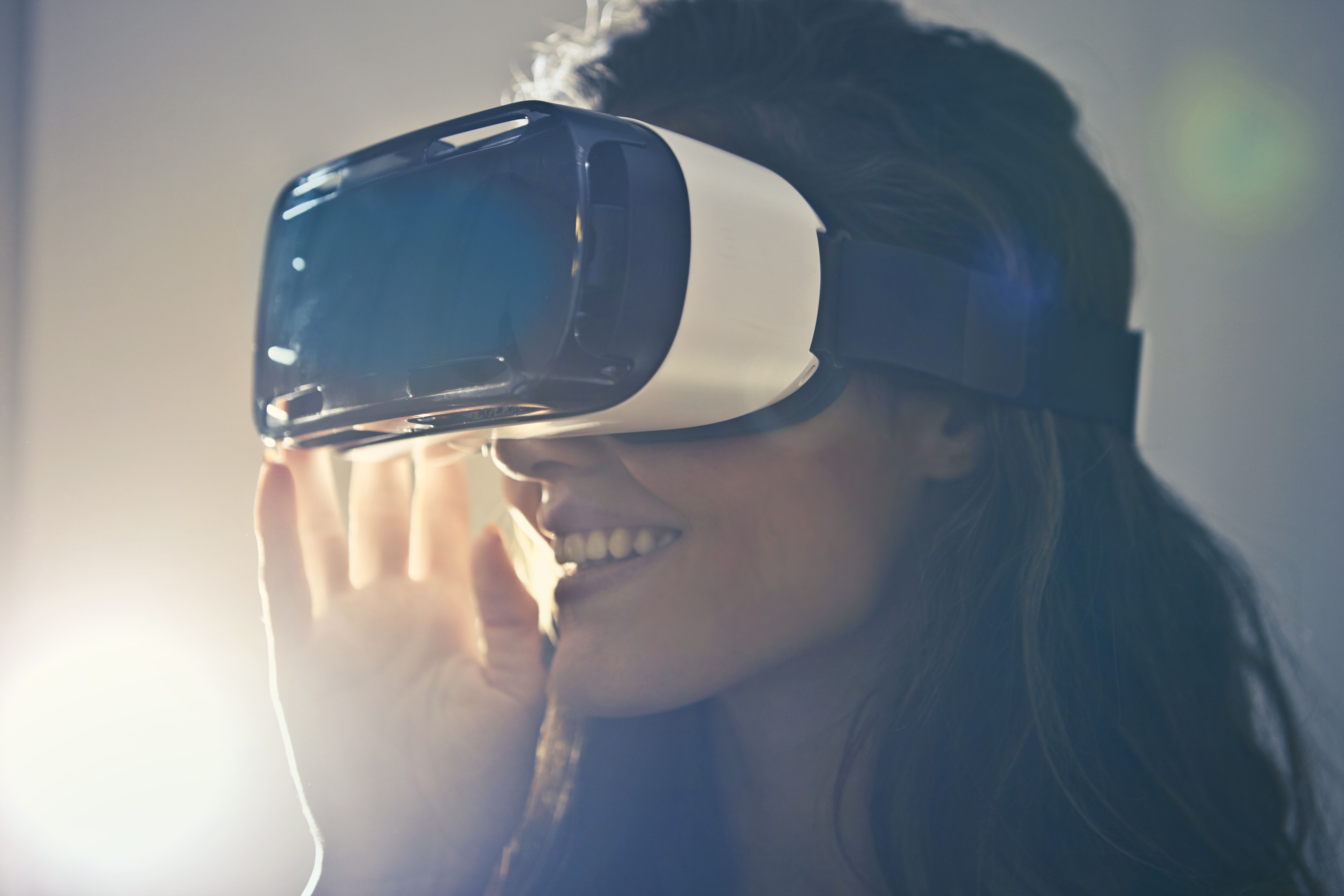 Man wearing white virtual reality goggles photo