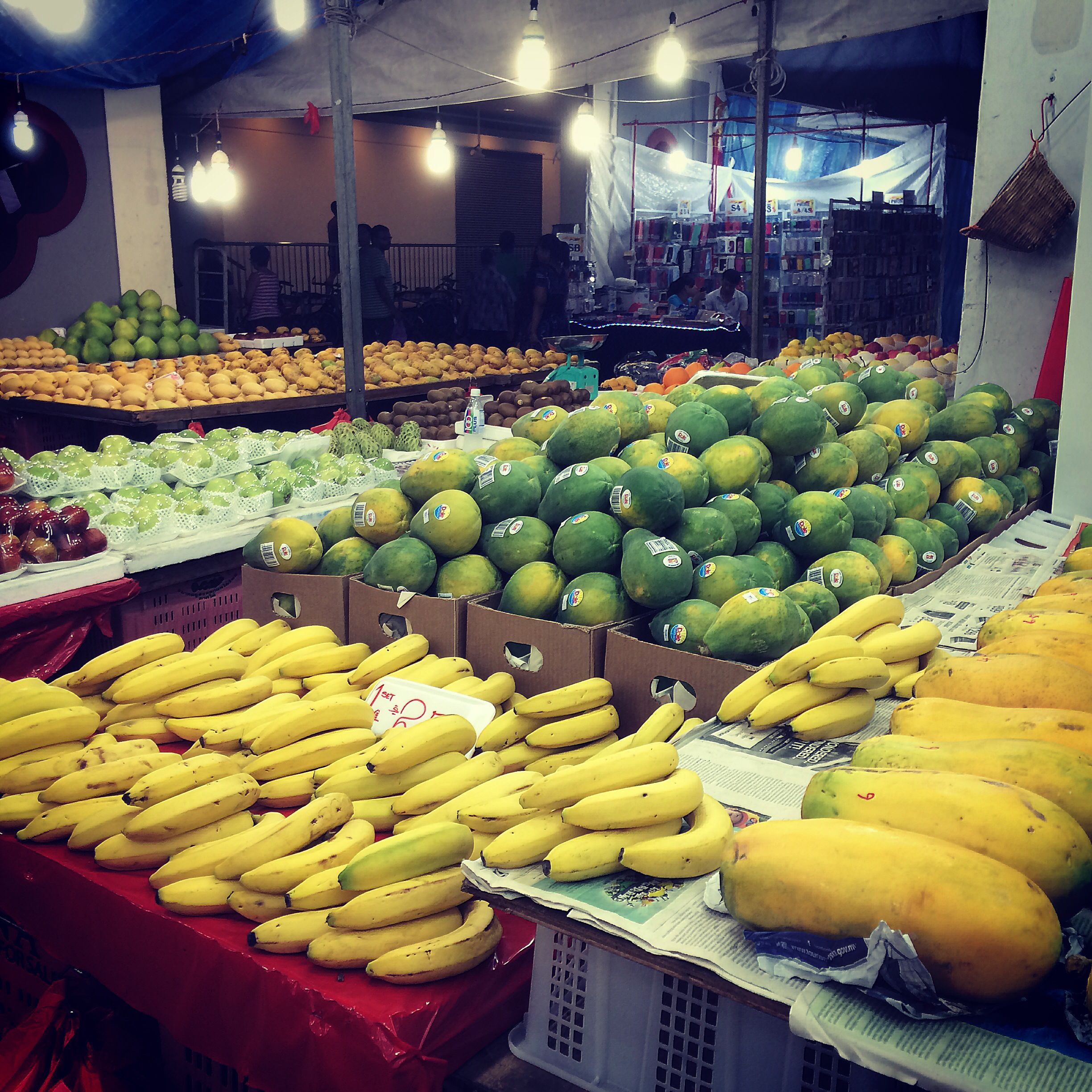 Open-air fruits stall. Selling both tropical and non-tropical fresh ...