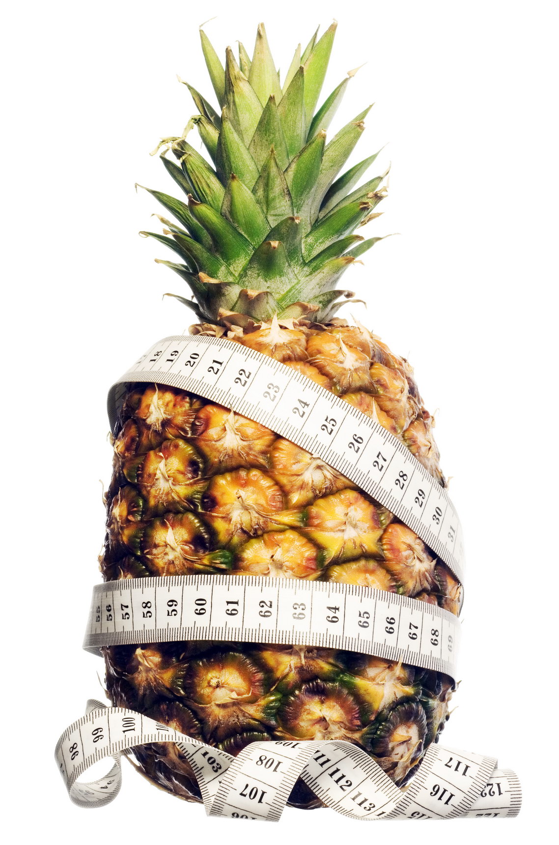 Measuring tape on pineapple photo