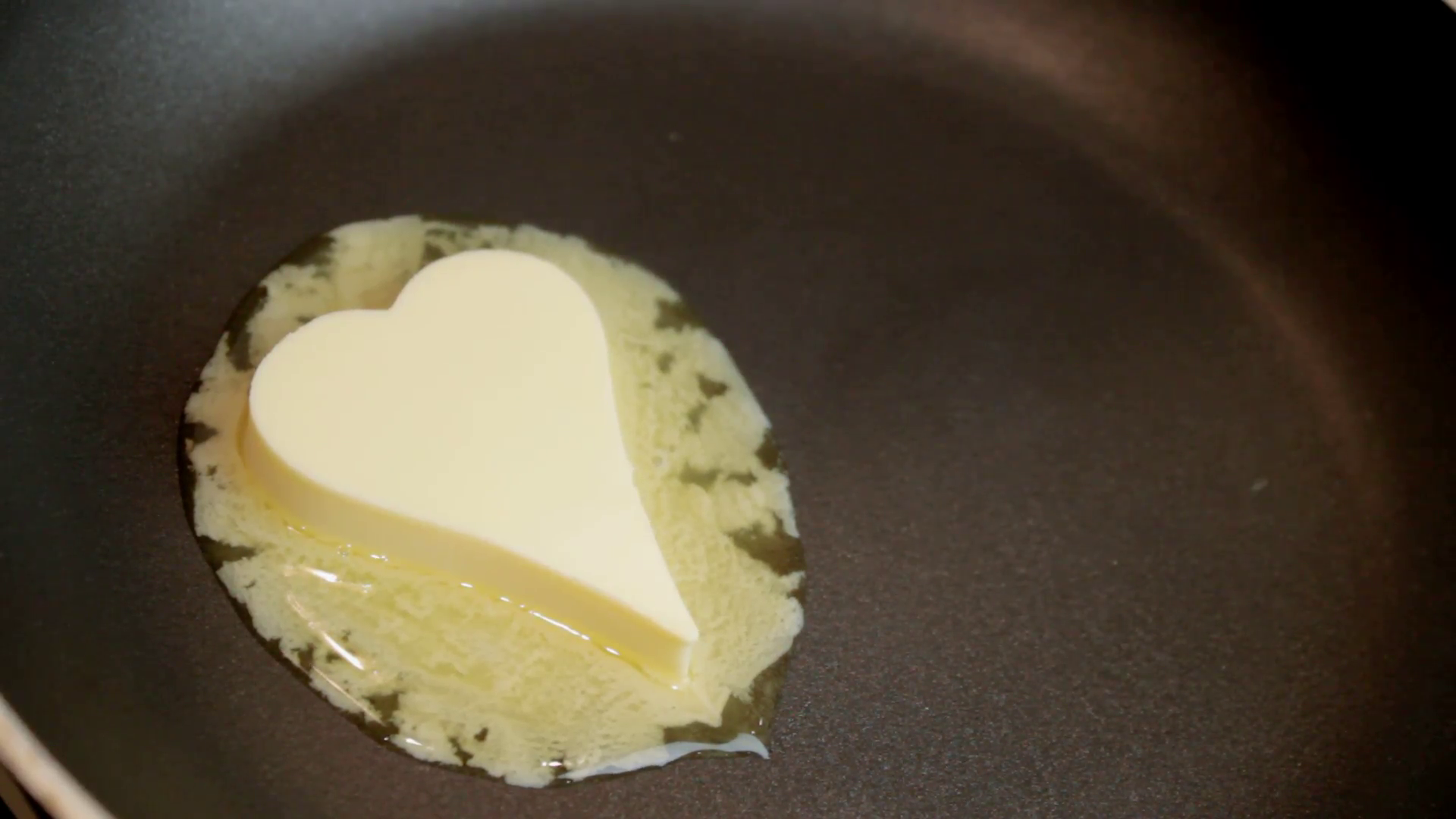 Heart made of butter melting in pan Stock Video Footage - Videoblocks