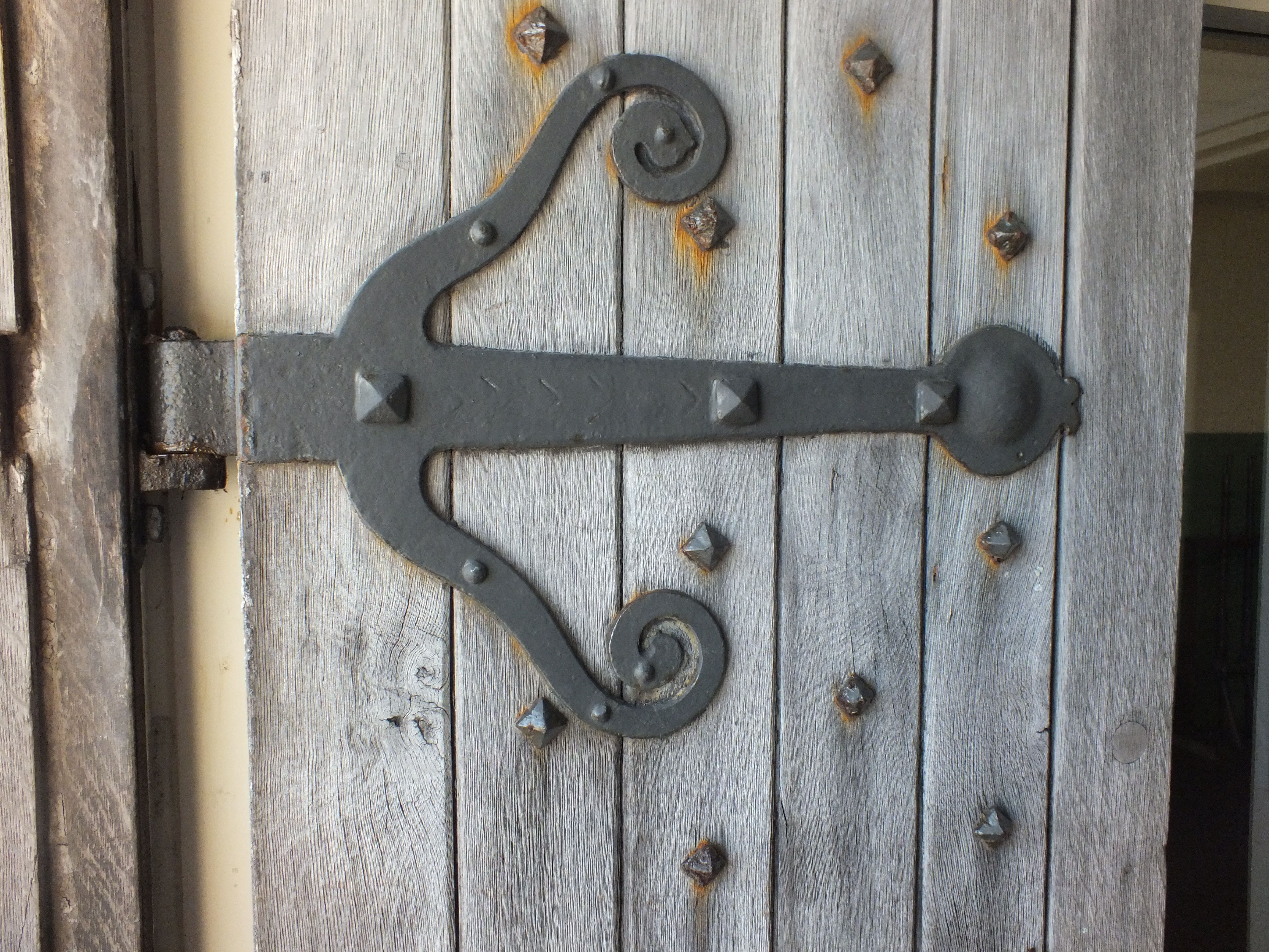 Beautiful strap hinge and door studs on an old oak door. This was ...