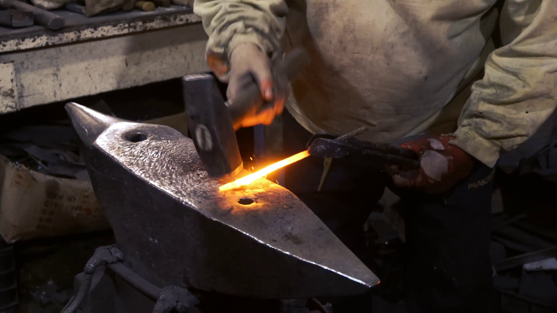 Blacksmiths working heated metal on anvil in workshop Stock Video ...