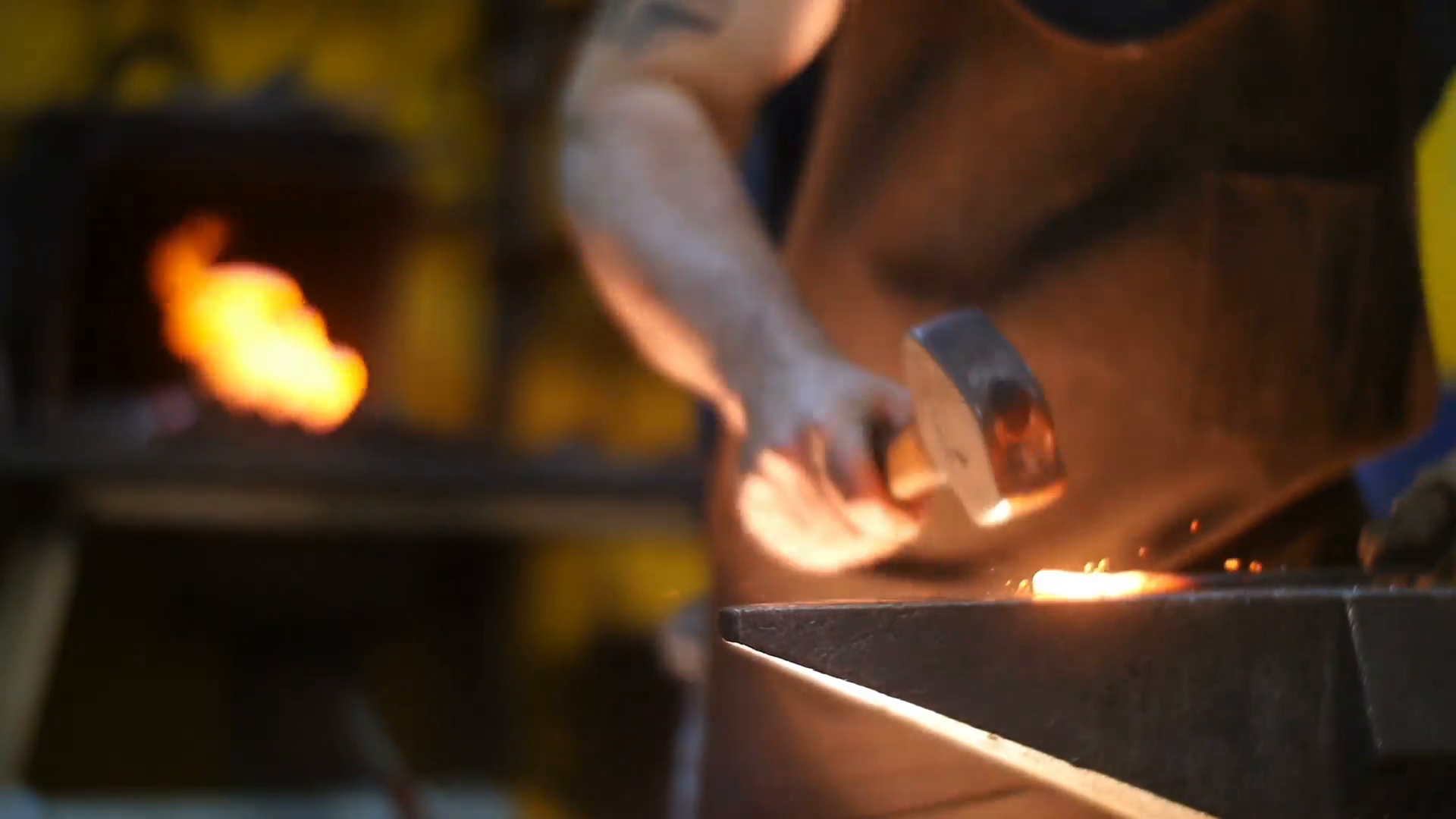 Blacksmith working with hammer on anvil in workshop Stock Video ...