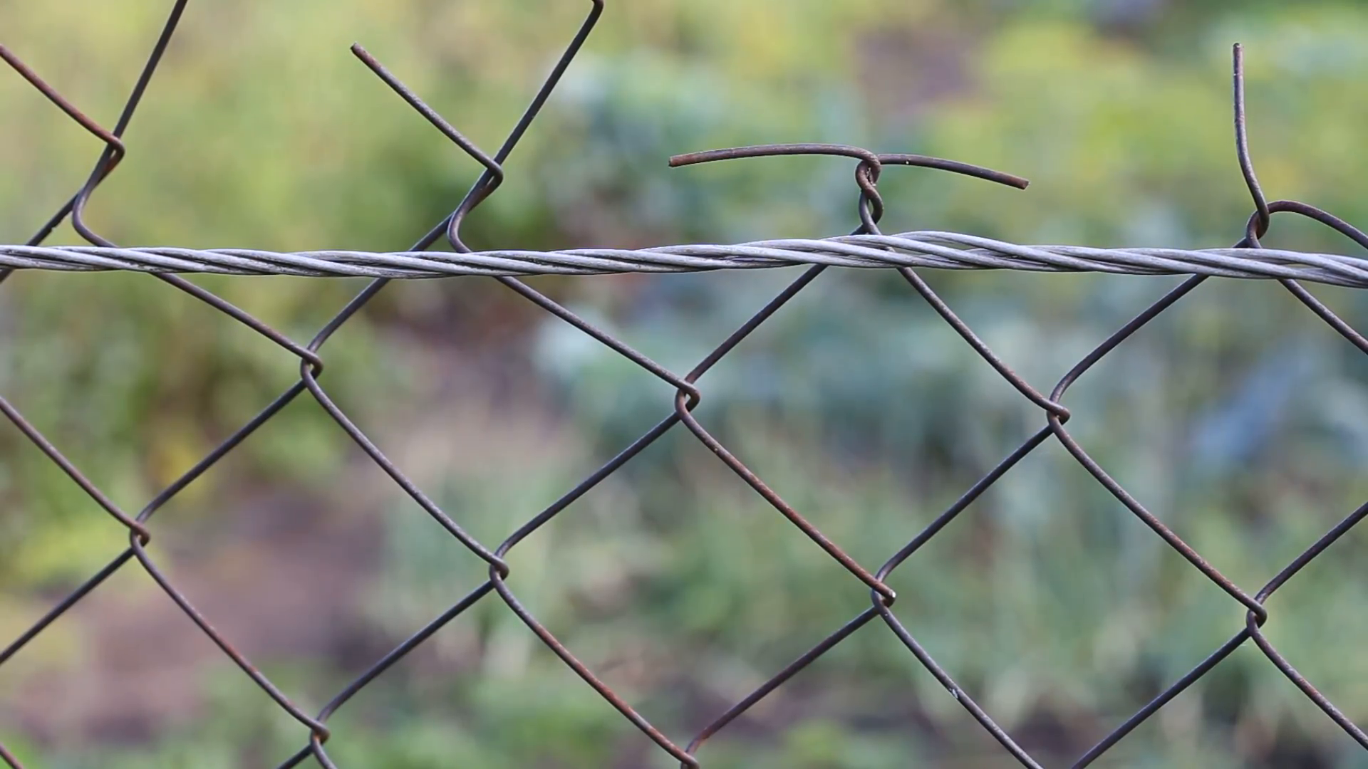 Barbed wire metallic fence, outdoors Stock Video Footage - VideoBlocks