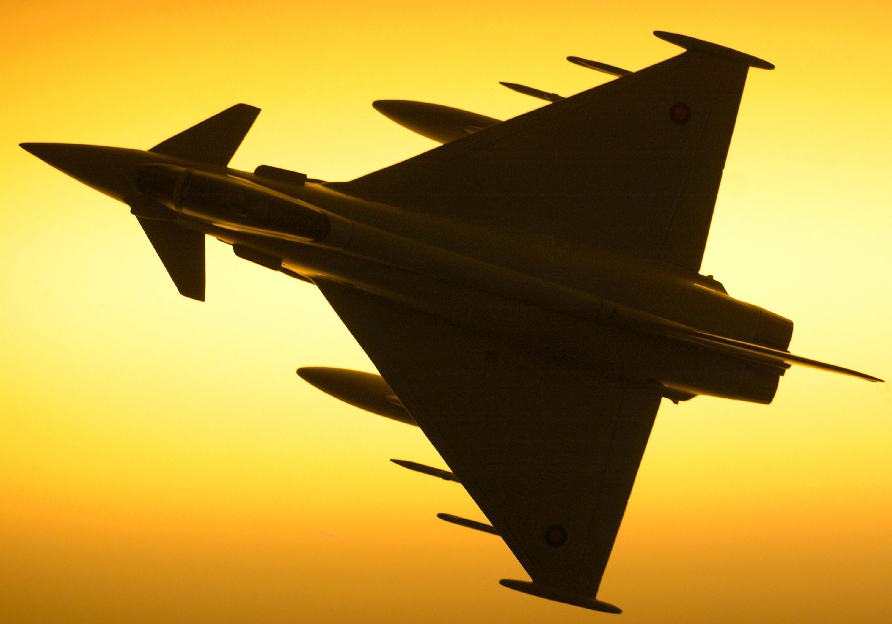 File:Royal Air Force Typhoon F2 jet fighter is silhouetted against ...