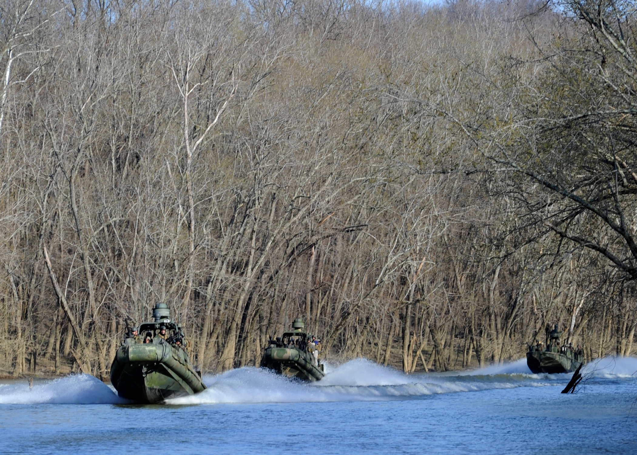 Military boats in the river photo