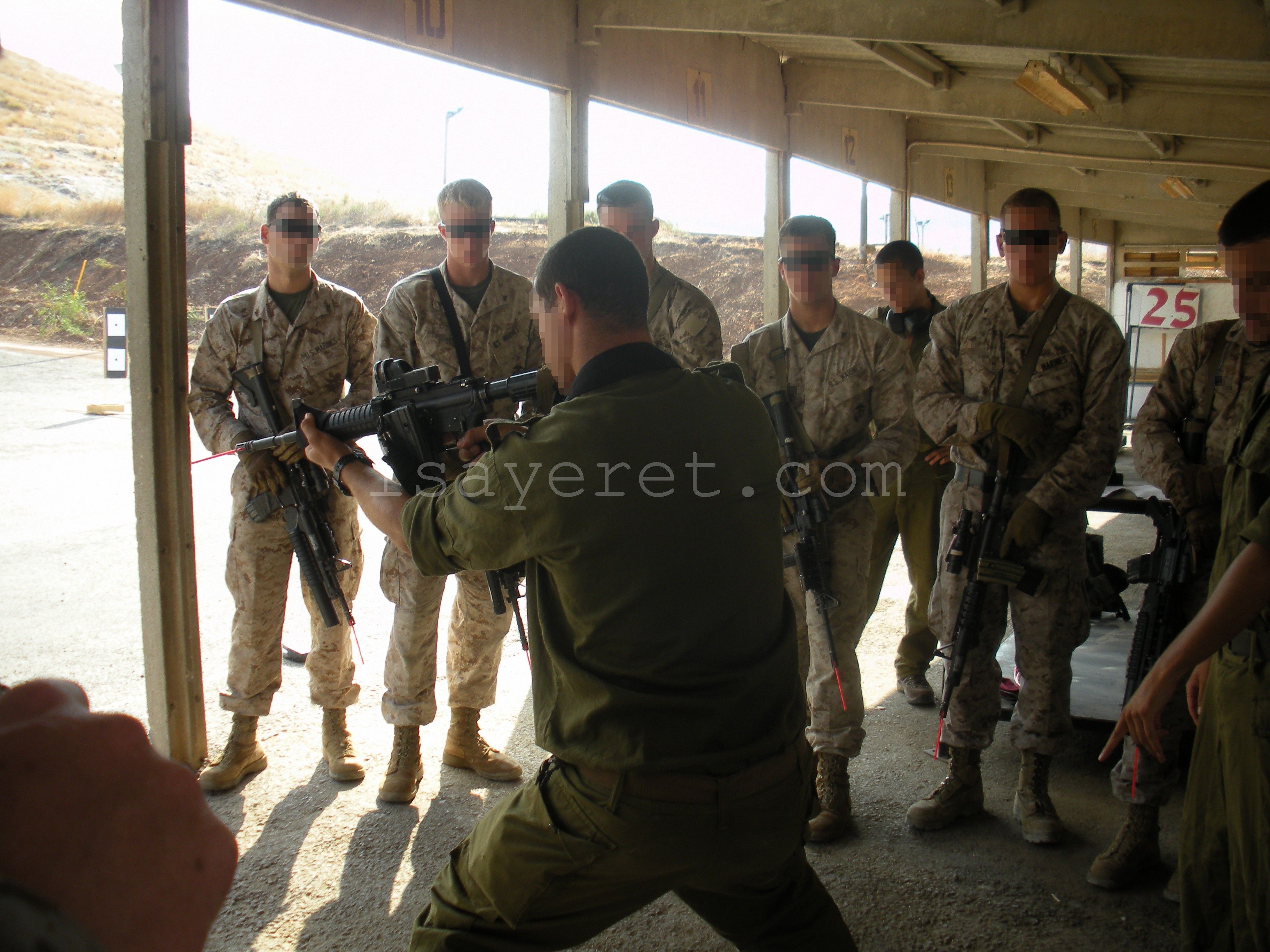 IDF Counter Terror Instructors (middle and left) demonstrate weapon ...