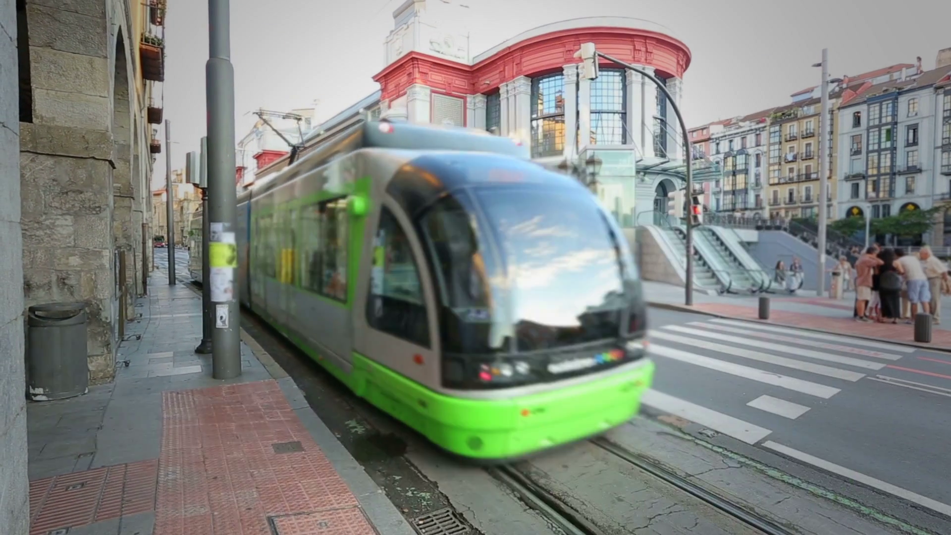 Modern tram car riding along Bilbao streets, public transportation ...