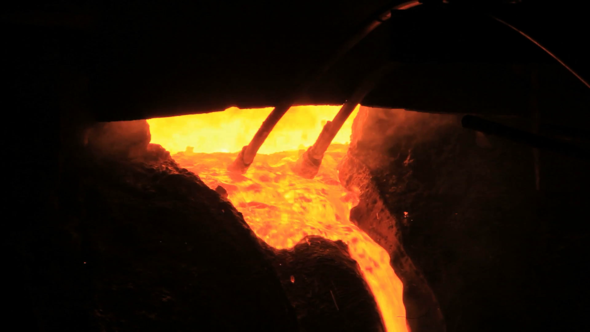 Molten metal start pouring from blast furnace. Metallurgical ...