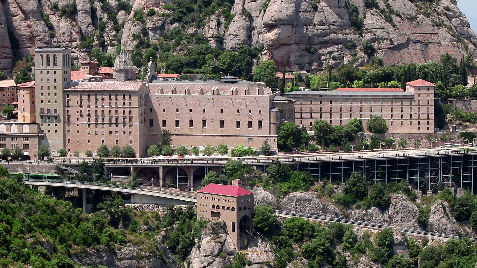 Montserrat monastery general view in Spain, Catalonia with tourists ...