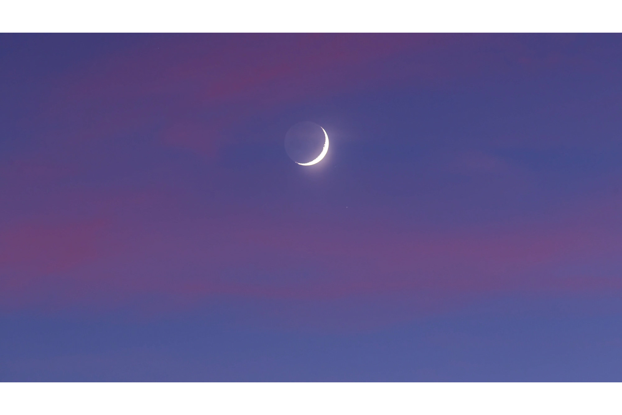 Time Lapse footage Crescent earthshine moonset during sunset