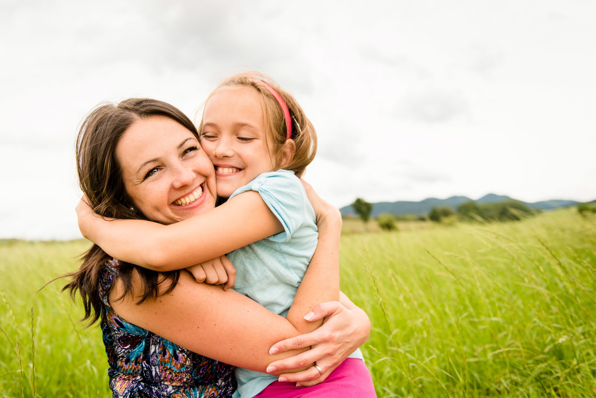 Mother and child hugging | Hog's Breath Cafe