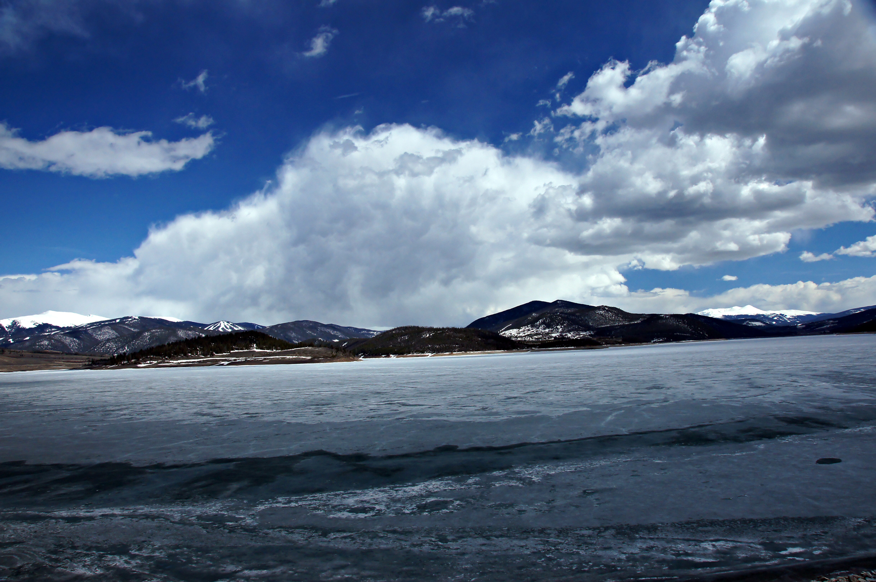 Mountain clouds over icy lake dillon photo