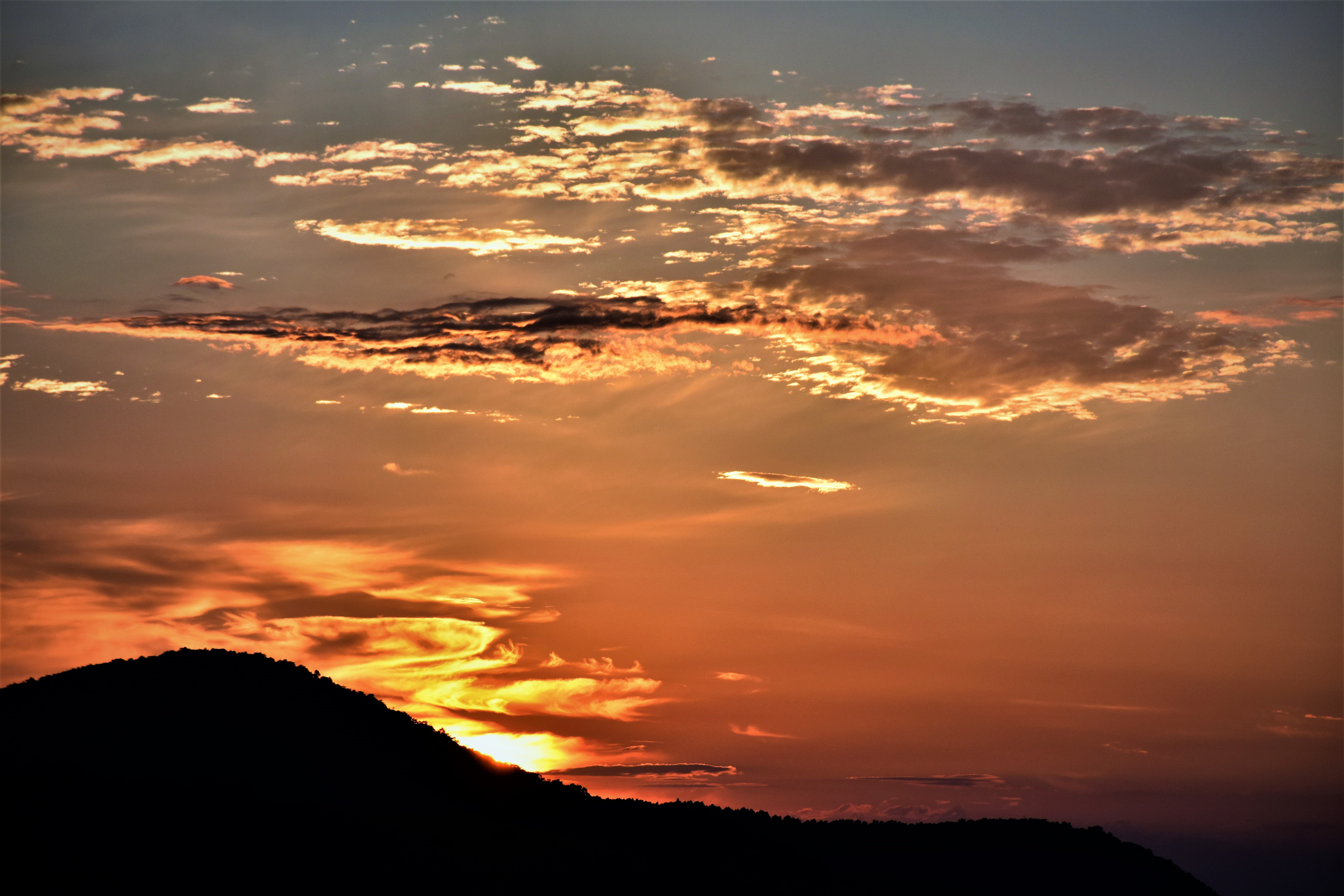 Mountain ruin silhouette during golden hour photo