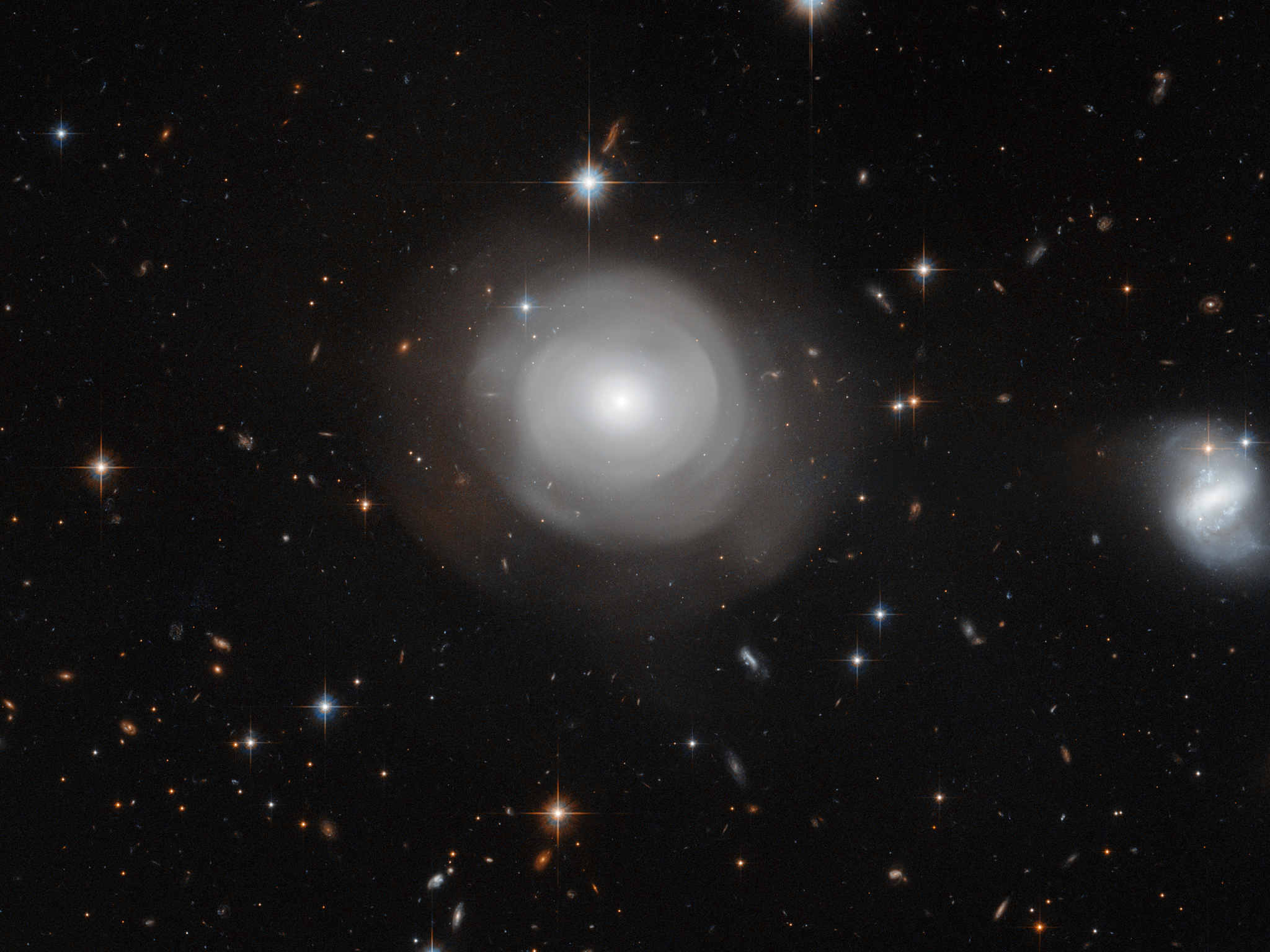 Elliptical galaxy shells the result of collisions.