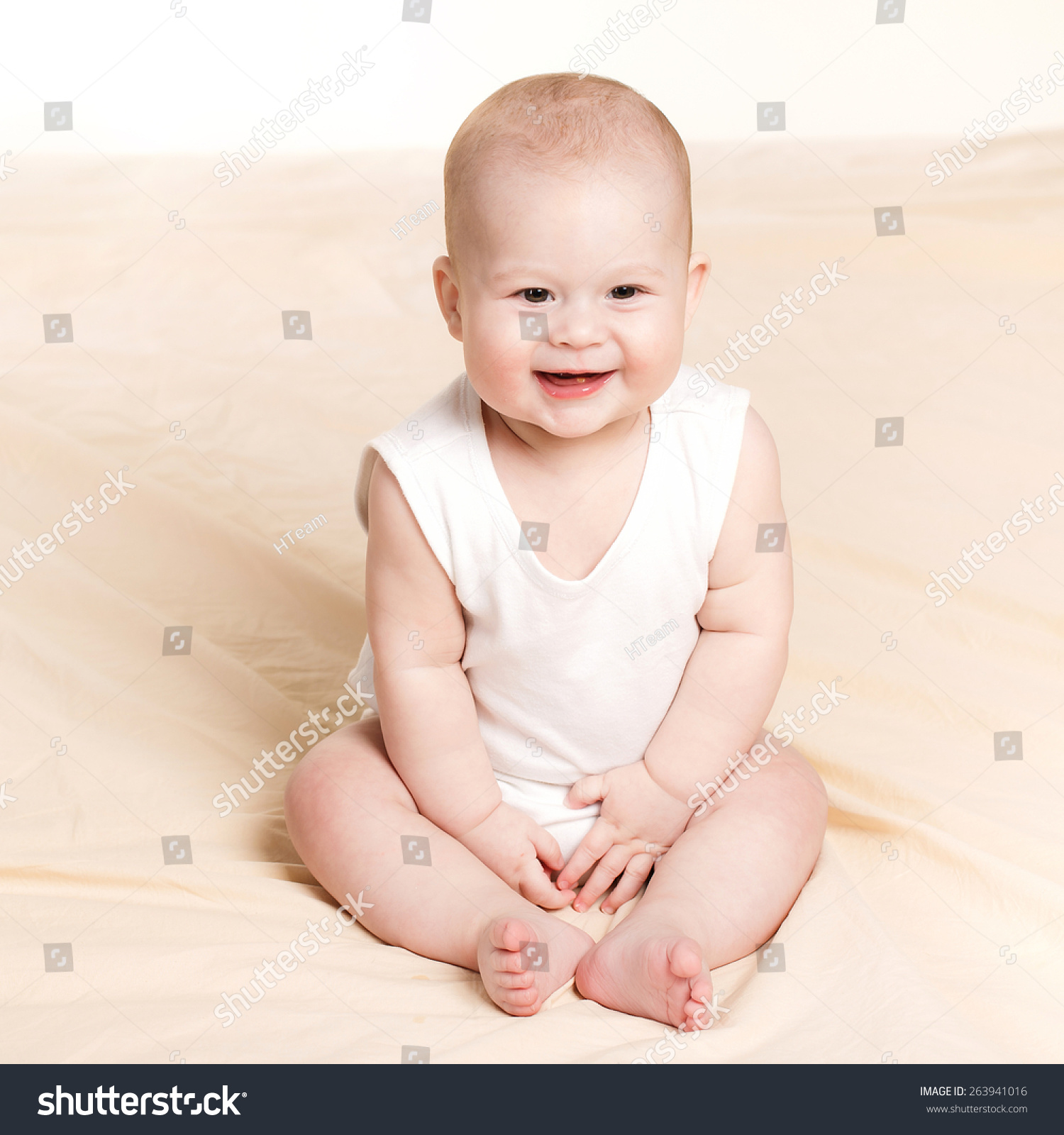 Adorable Baby Sitting Looking Aside Over Stock Photo (Royalty Free ...
