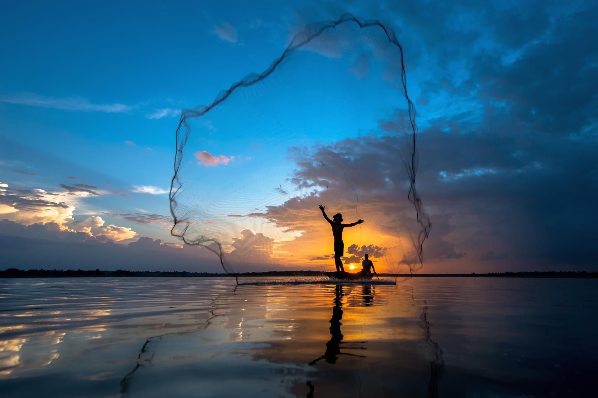 Photograph Tropical net fishing in sunset. by Jakkree Thampitakkul ...