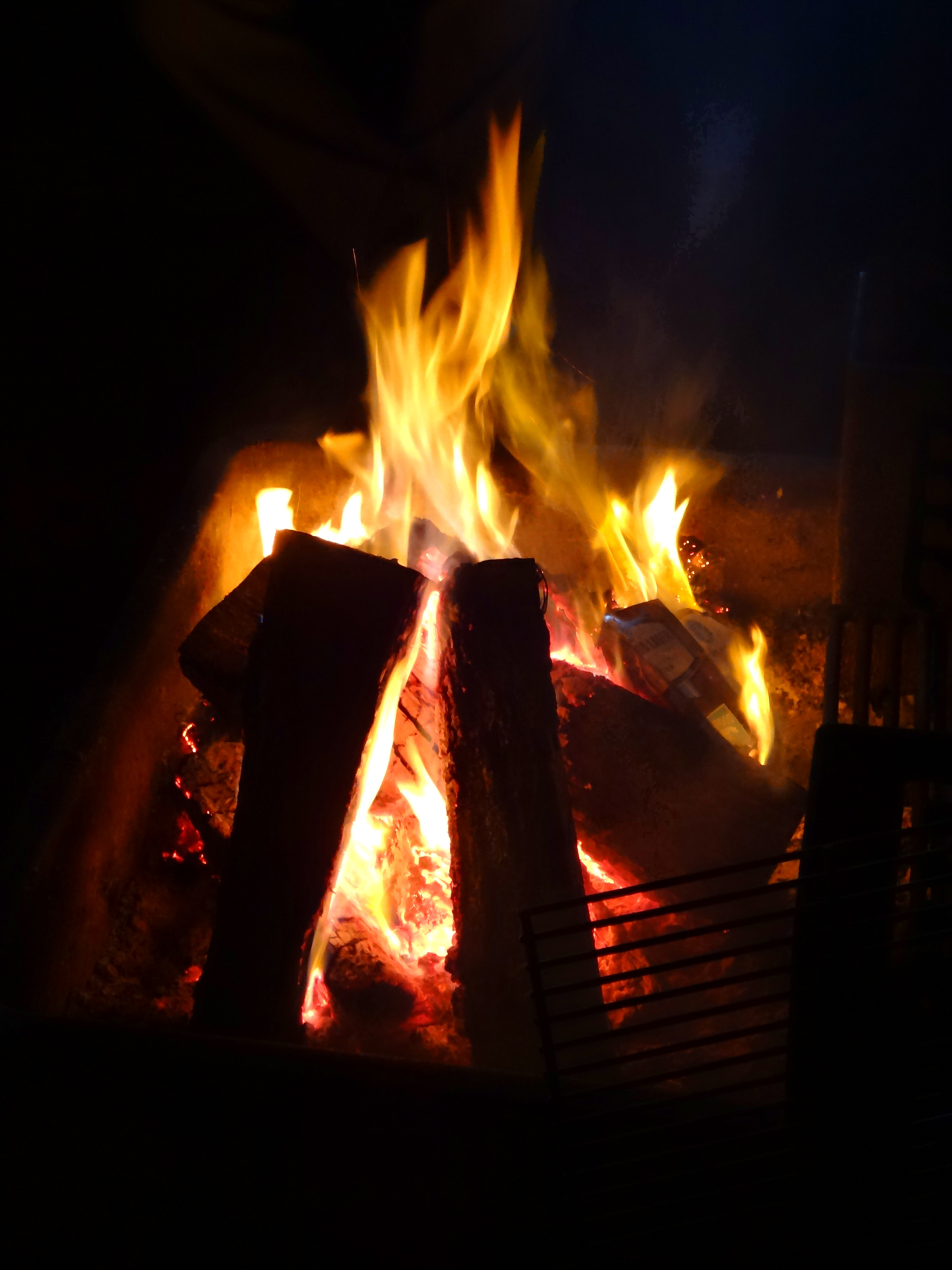 Flames in a fire pit at night - Blaze Stock Photography